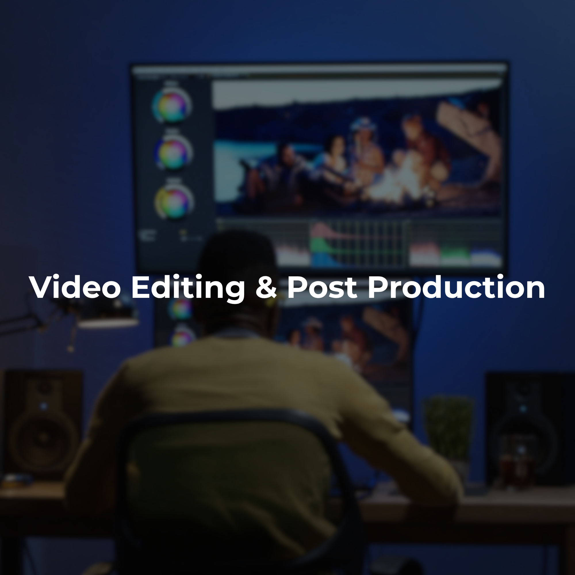 A person is working on video editing and post-production on a computer screen in a dimly lit room.