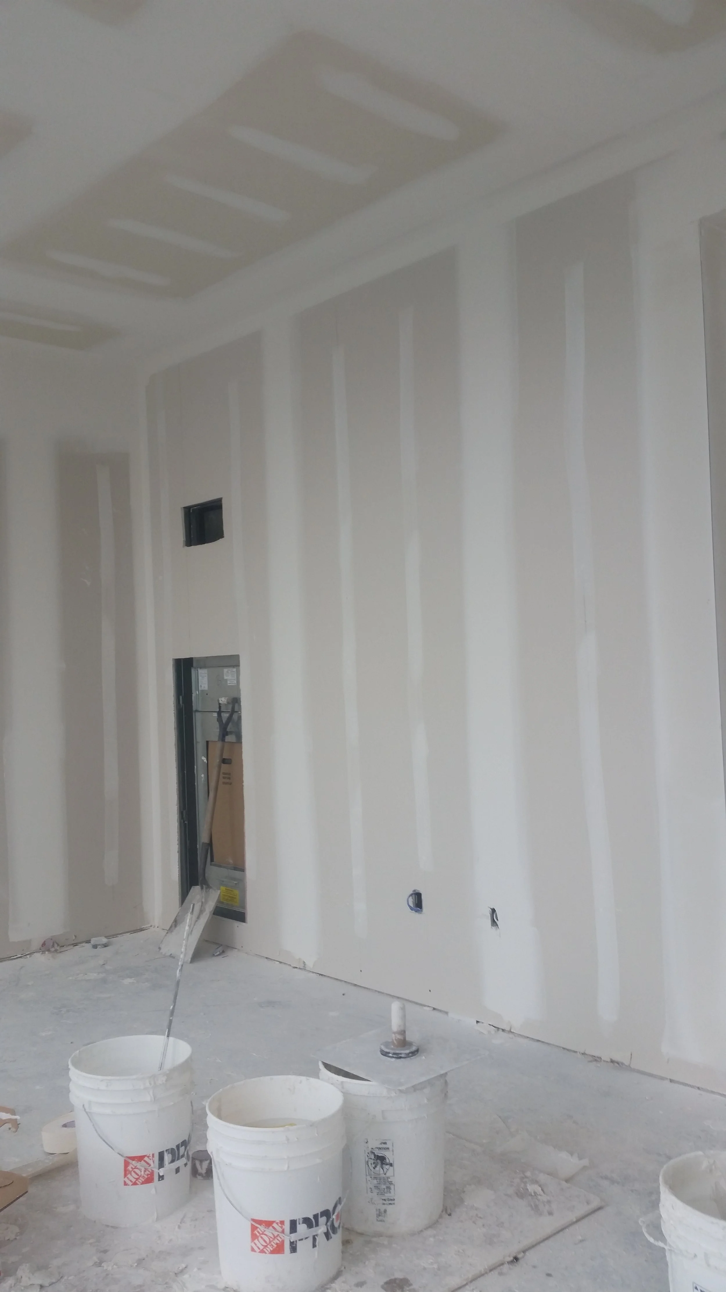 Drywall taping and finishing stage of a residential renovation project in Toronto.