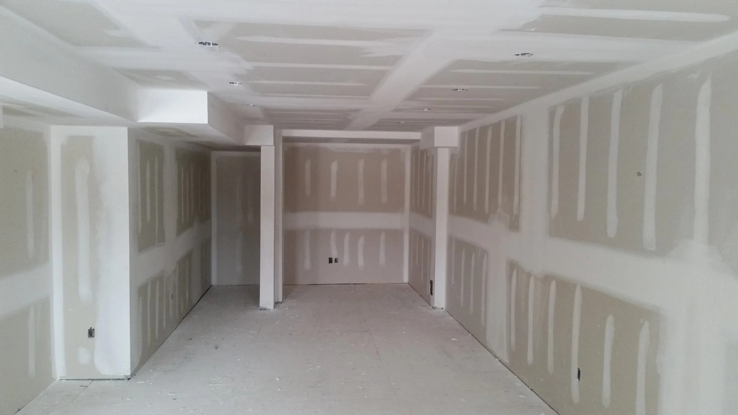 Drywall taping and finishing project during a home renovation in Oakville.