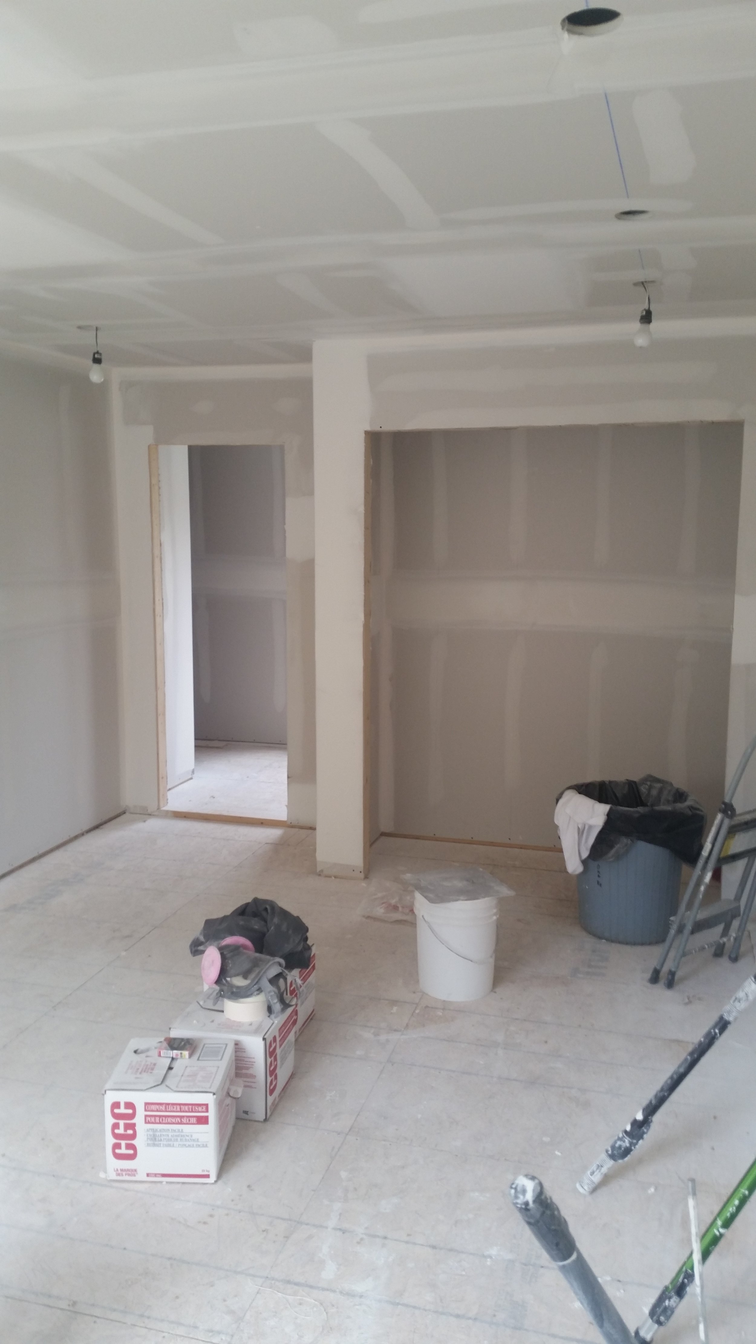 Drywall installation and taping during a custom home renovation in Oakville