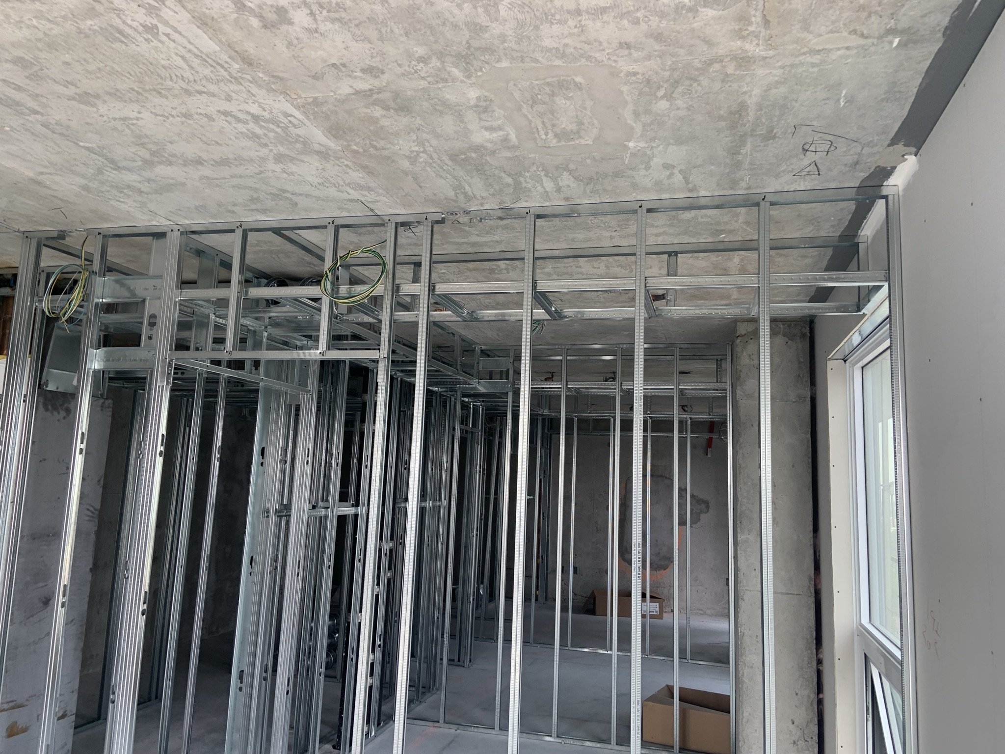 Steel stud framing installation completed during a condo renovation in Mississauga.
