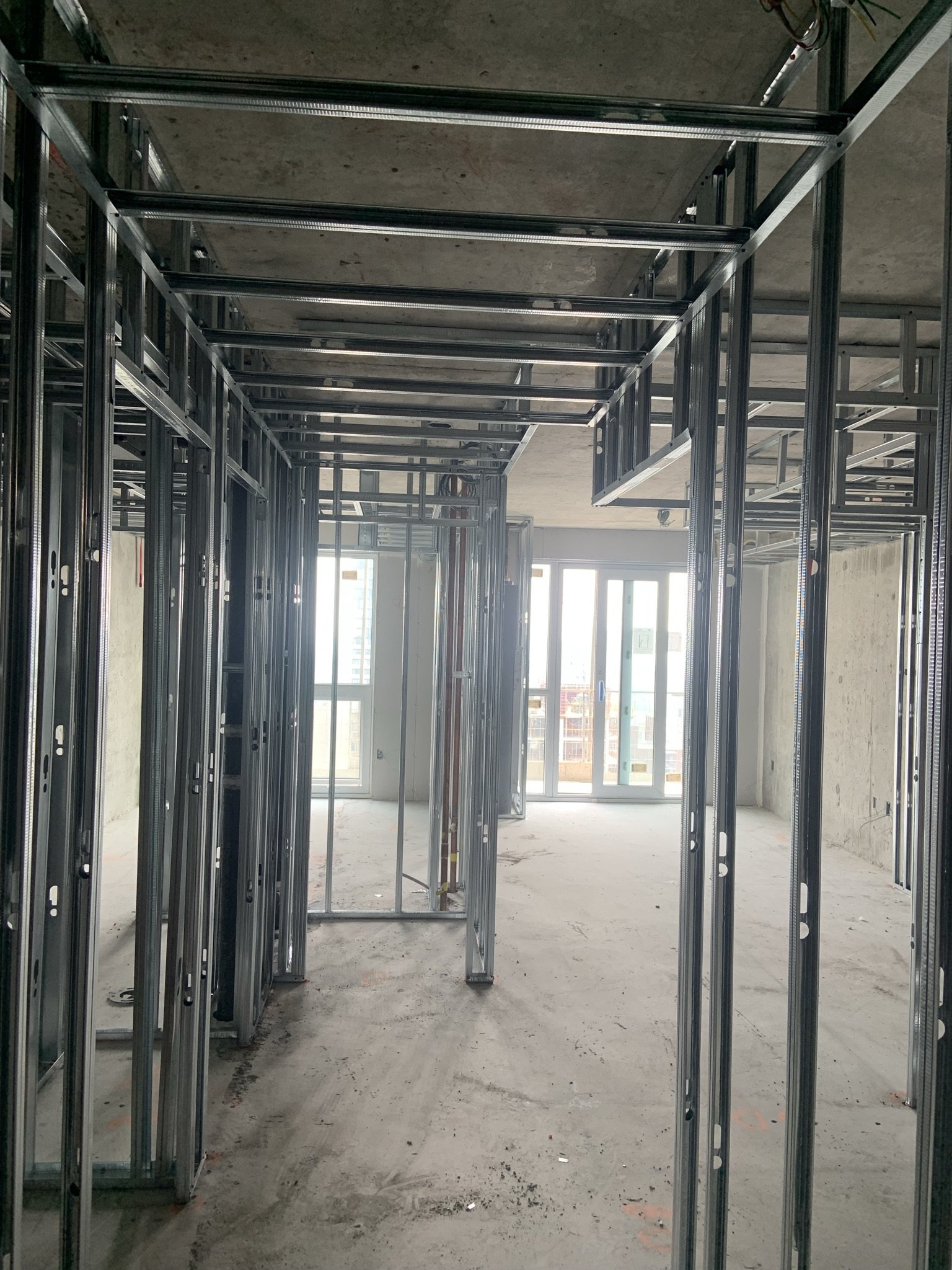 Metal stud framing installation for a condominium renovation project in Toronto by Ontario Drywall Finishes.