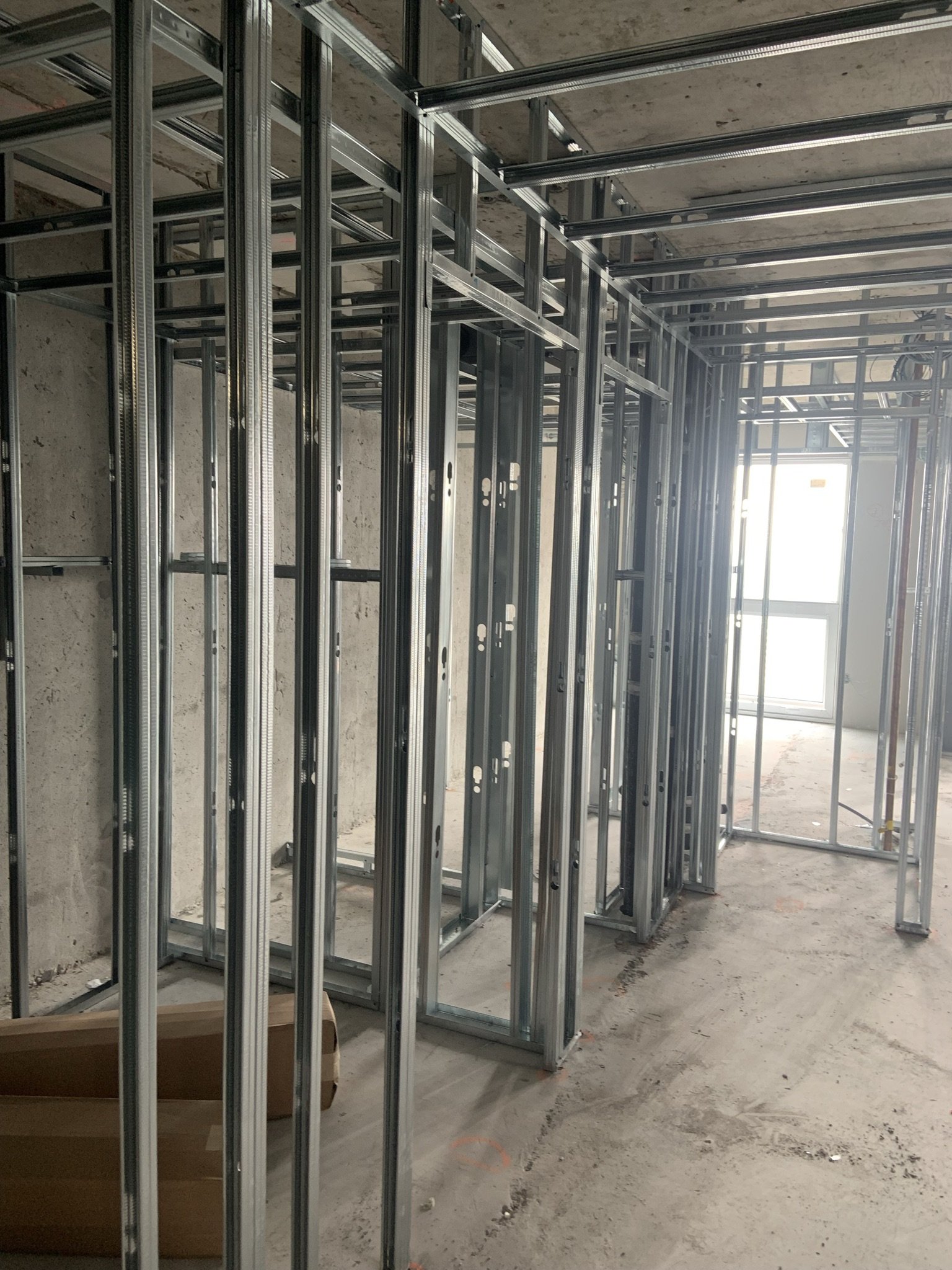 Metal stud framing installation for a condominium renovation project in Toronto by Ontario Drywall Finishes.