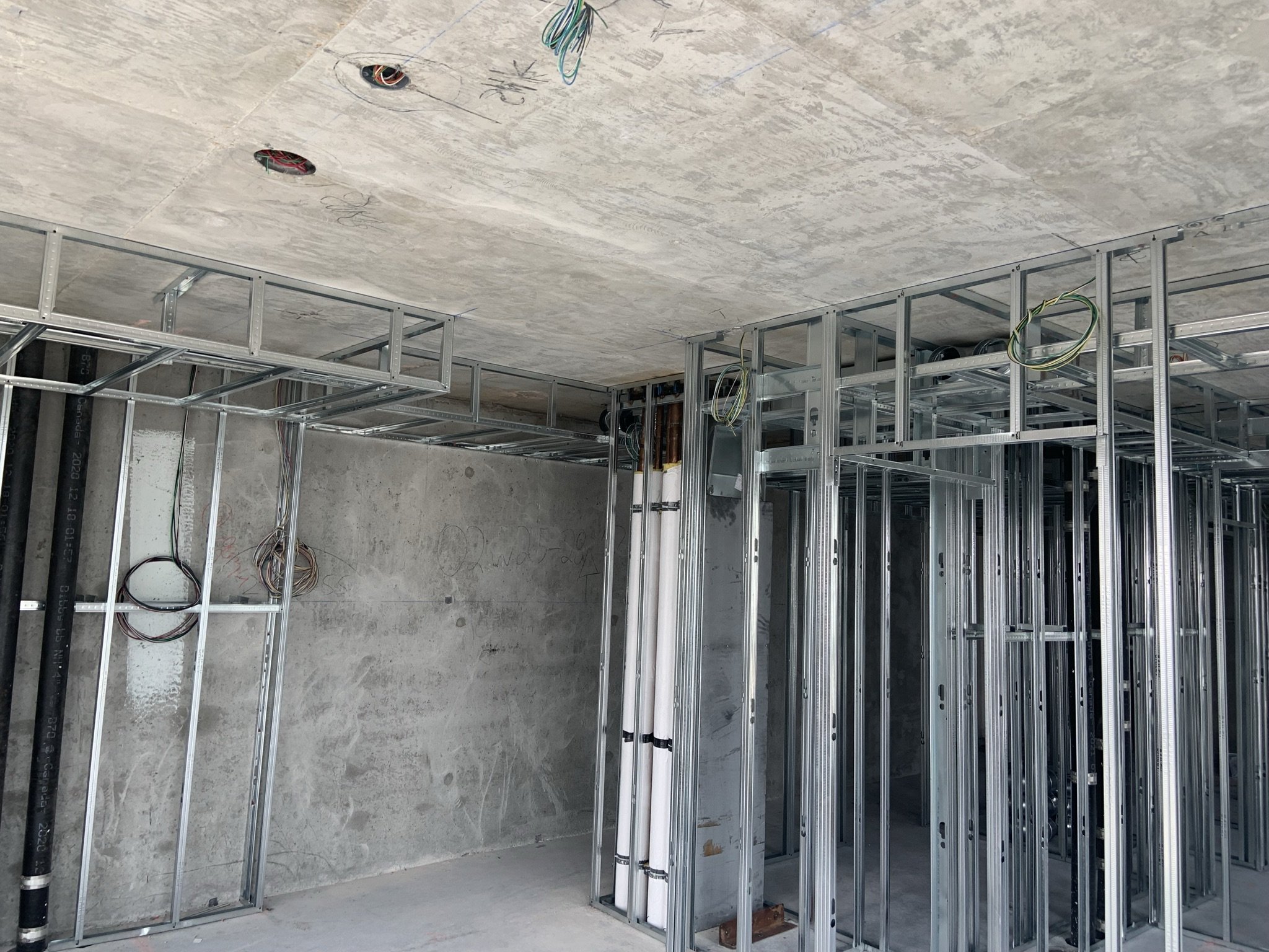 Metal stud framing and interior partition layout for a condominium project in Toronto.