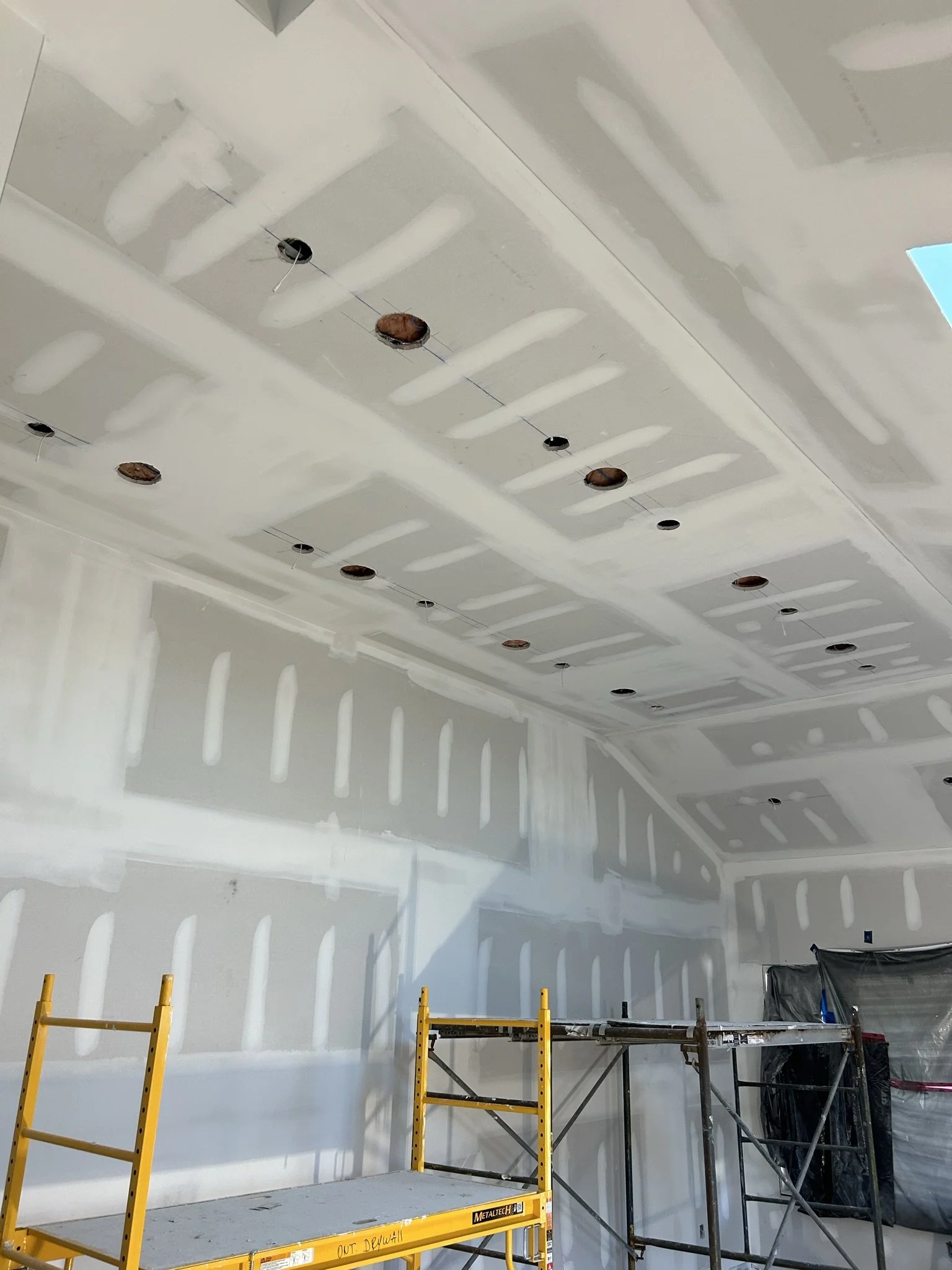 Professional drywall taping completed during a luxury custom home build in Oakville.