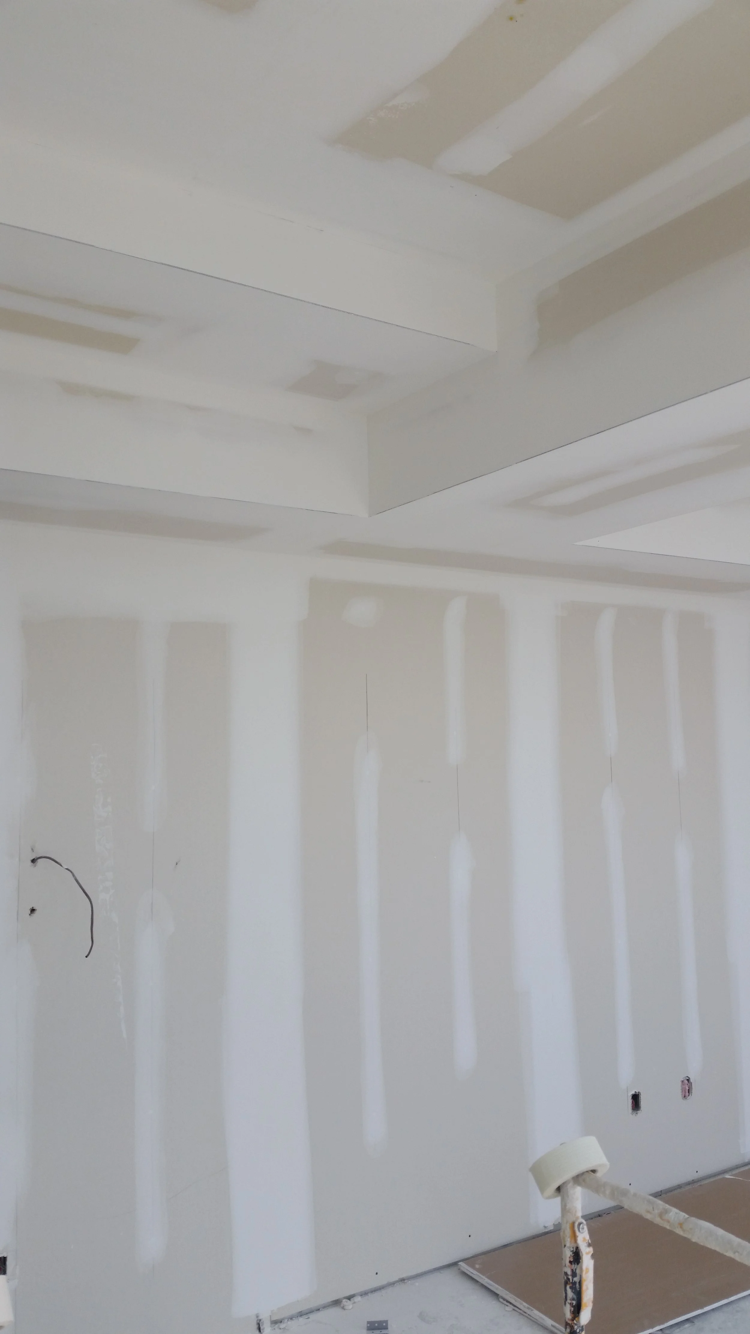 Interior wall under construction with drywall, taped and mudded, in Mississauga.