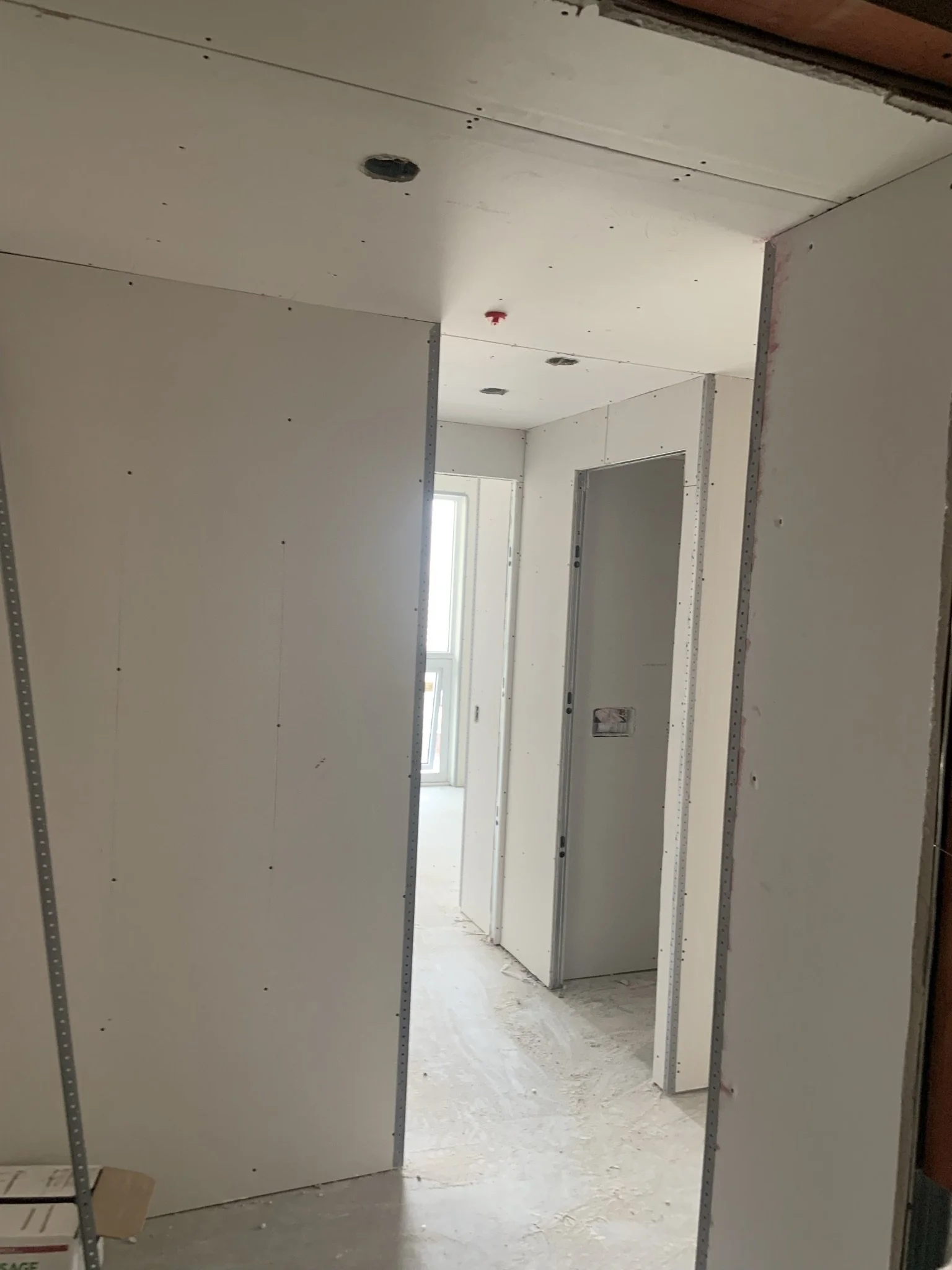 Drywall installation completed during a condominium renovation project in Toronto.