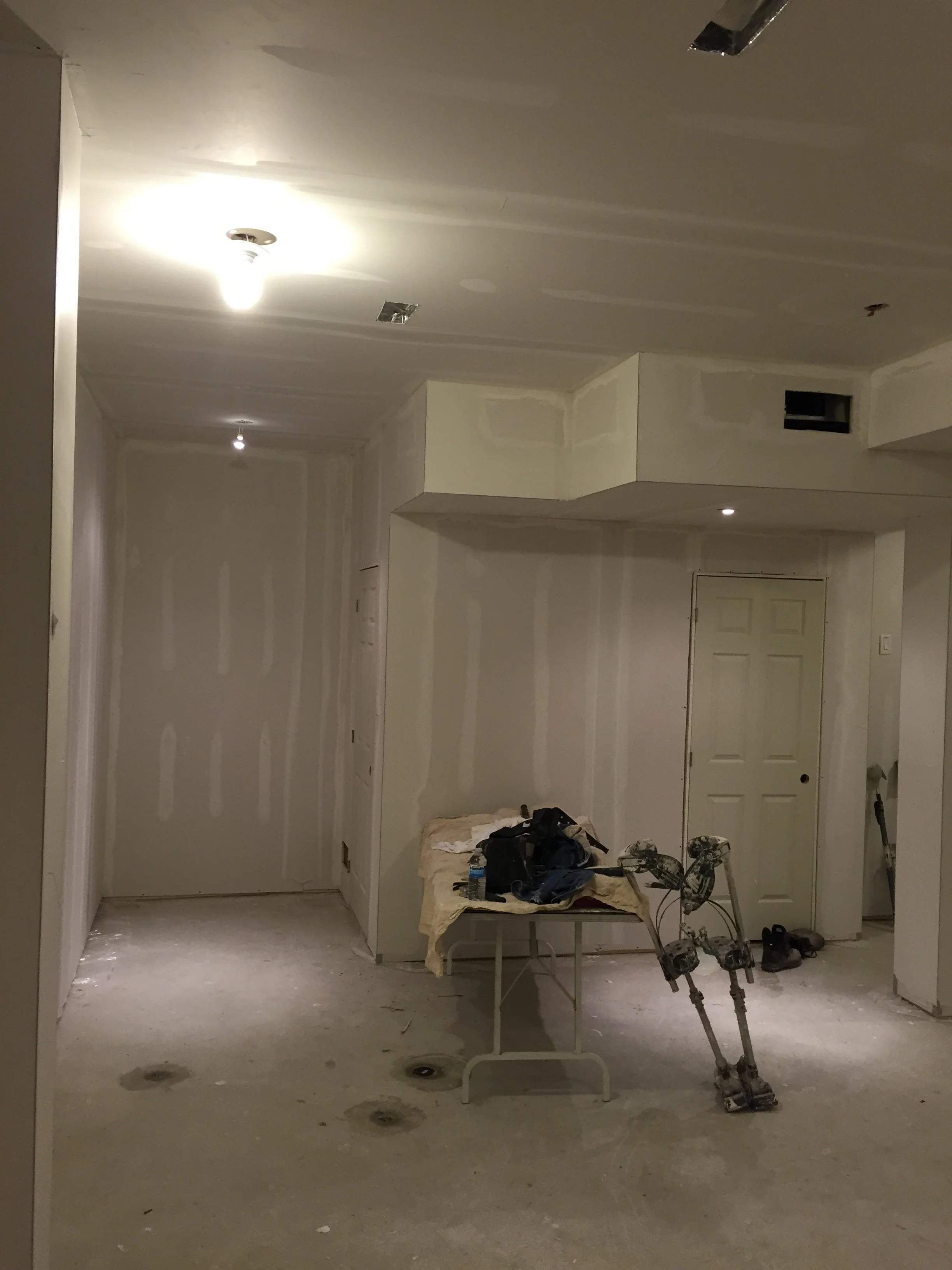 Custom basement drywall installation project in Etobicoke.