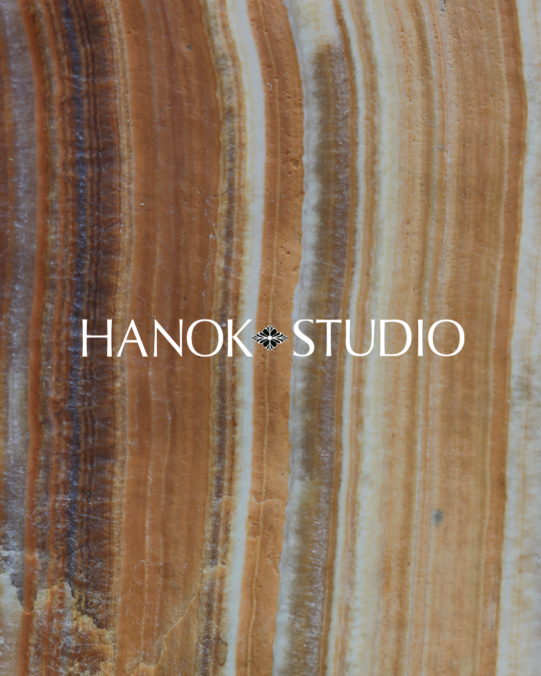 Hanok Studio branding visual on orange and brown stone visual, designed by Sunnii Studios
