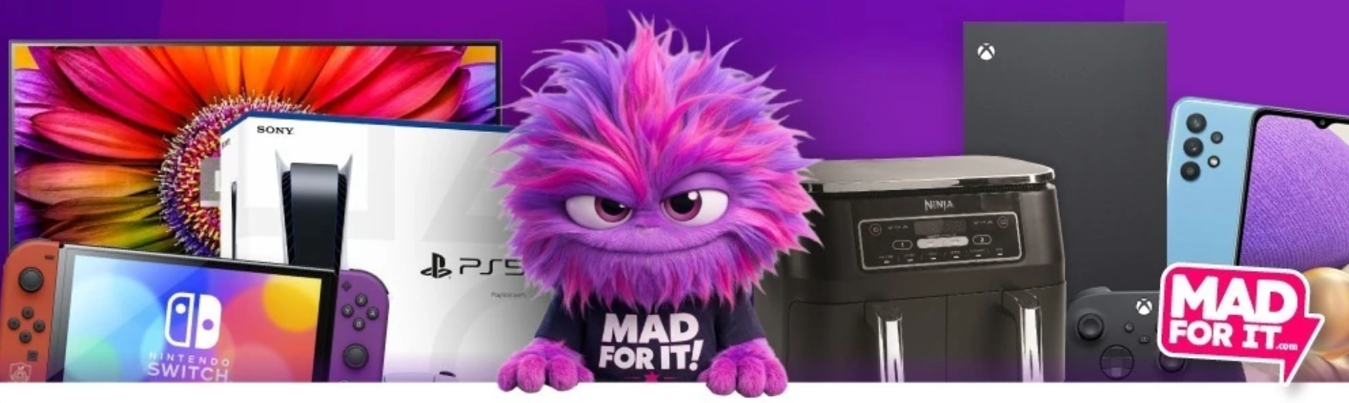 Collection of gaming and electronic devices including a Nintendo Switch, PlayStation 5, PS5 box, an air fryer, a black Xbox Series X, and a smartphone, with a purple fuzzy monster mascot in the center wearing a "MAD FOR IT!" shirt and the "MAD FOR IT" logo in the bottom right corner.