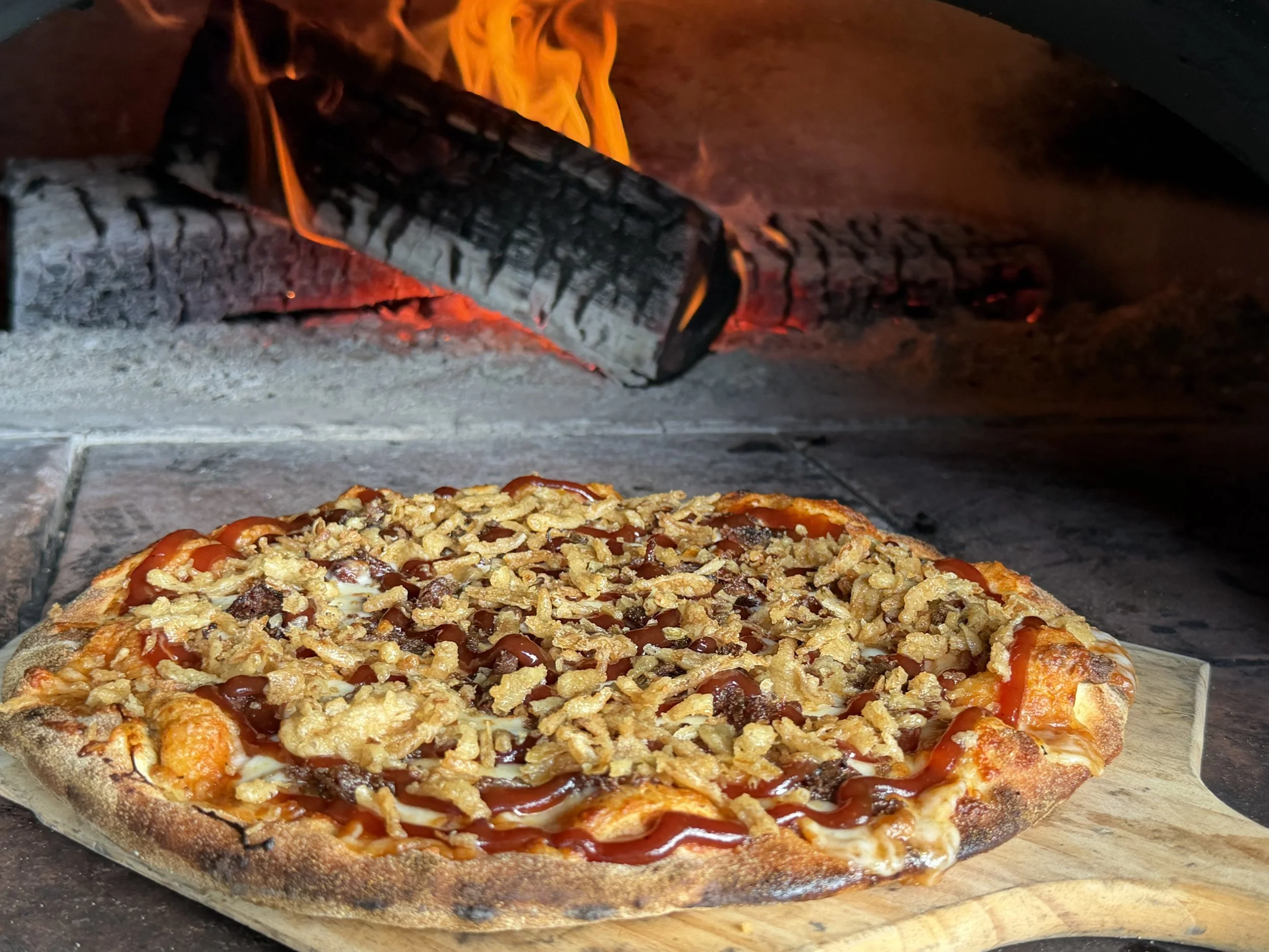 Our pizzas are wood-fired and cooked to perfection to provide a rich, robust taste that tantalizes your taste buds.