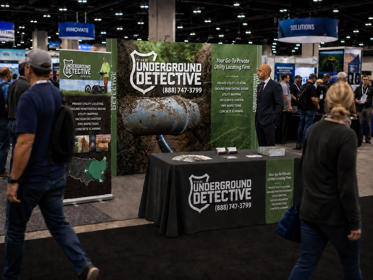 Underground Detective backwall display, banner stand, and table drape at a Trade Show