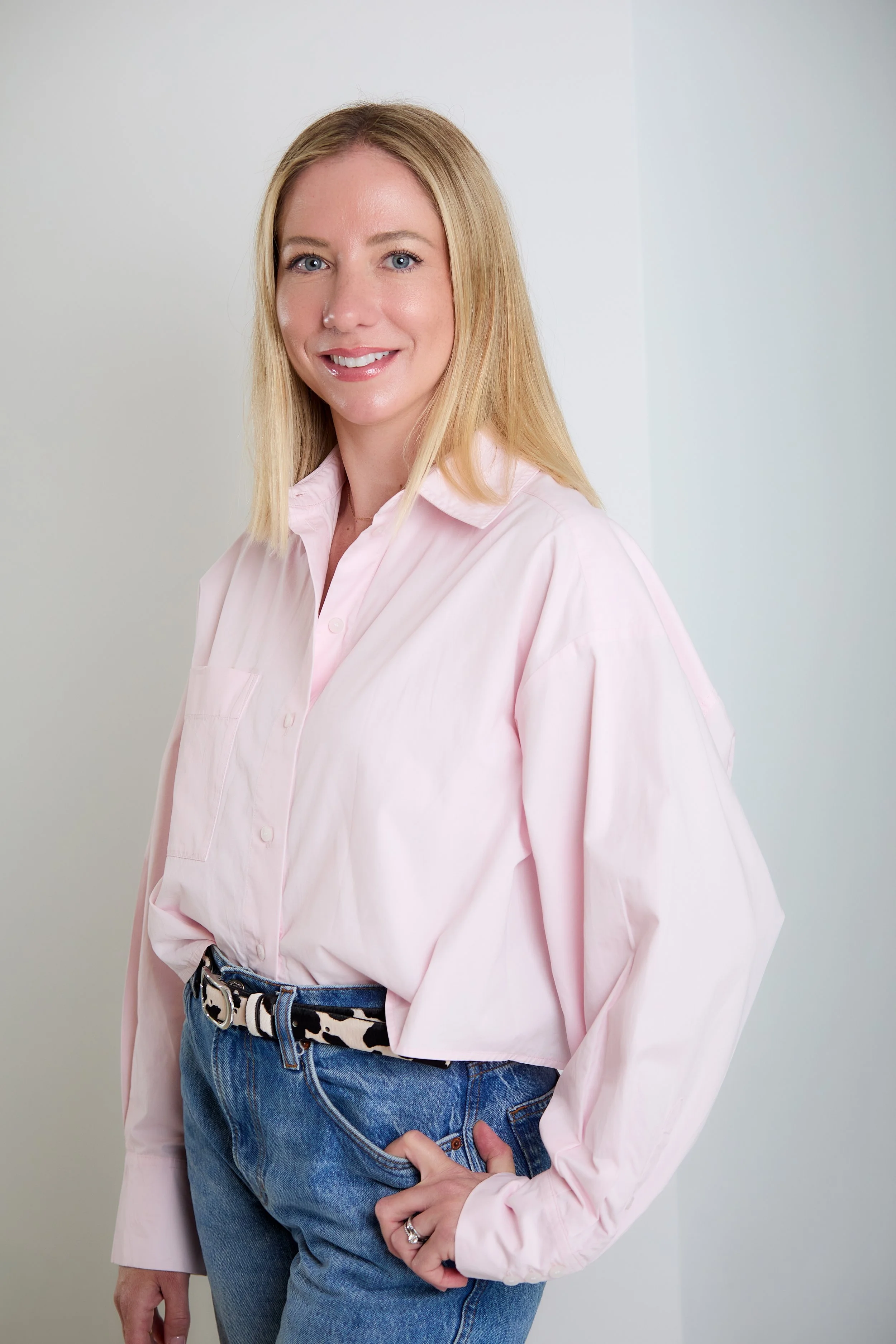 Jade Powell, co-founder of Salt Bespoke, in a relaxed pink shirt and jeans
