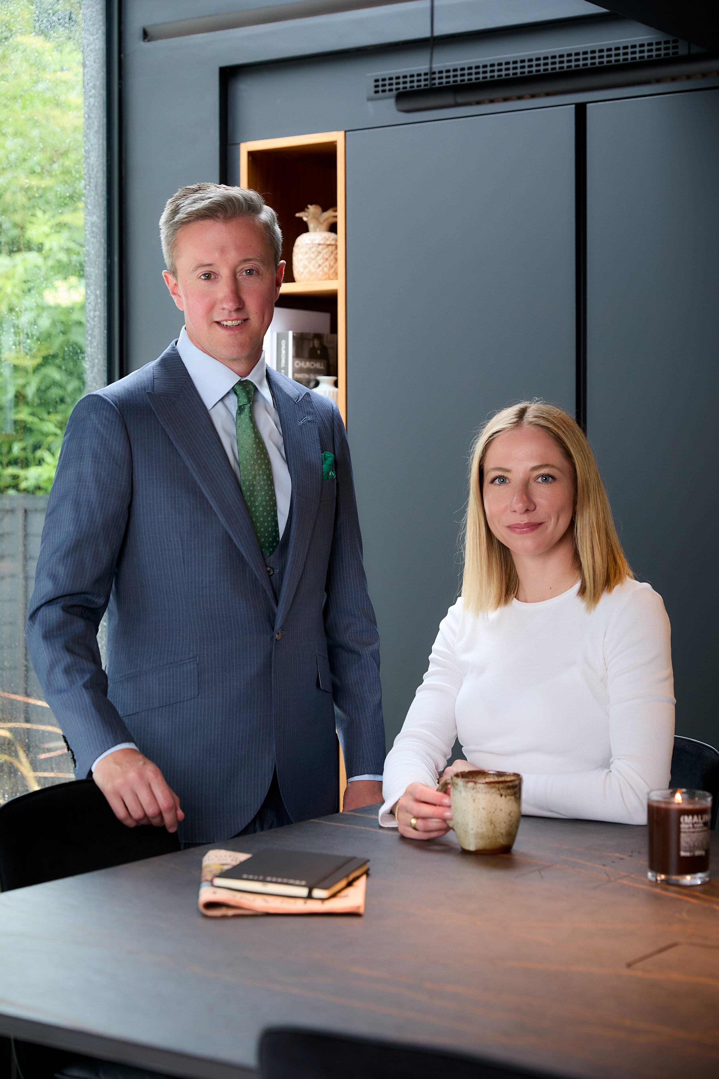 Jade Powell and Ian Powell the founders of Salt Bespoke in a professional setting wearing a suit and custom outfit