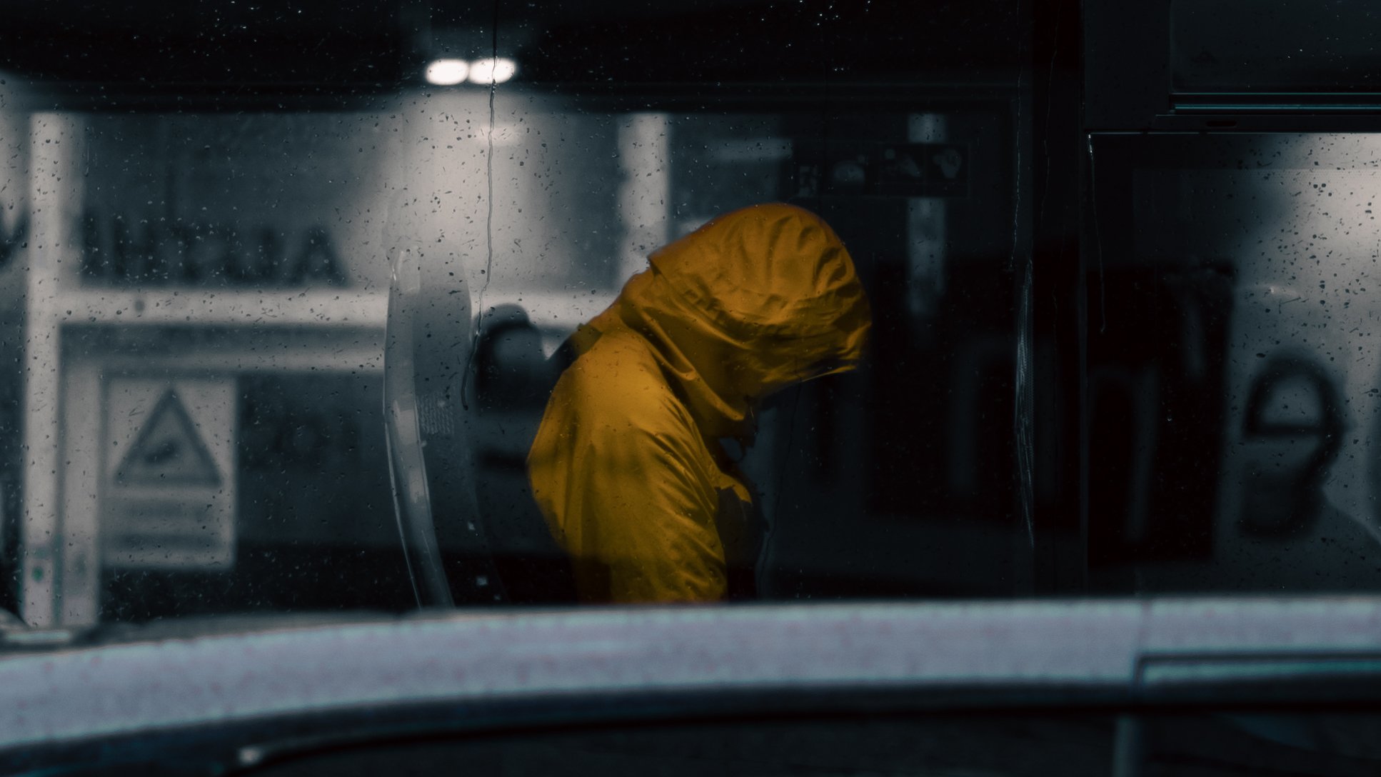 Yellow hooded jacket on a bus
