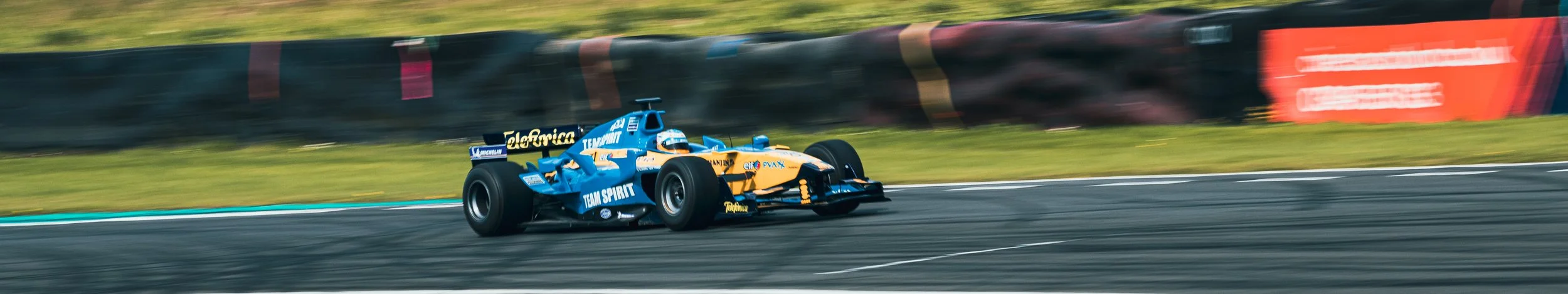 Panning shot of Fernando Alonso's old race car at knockhill 
