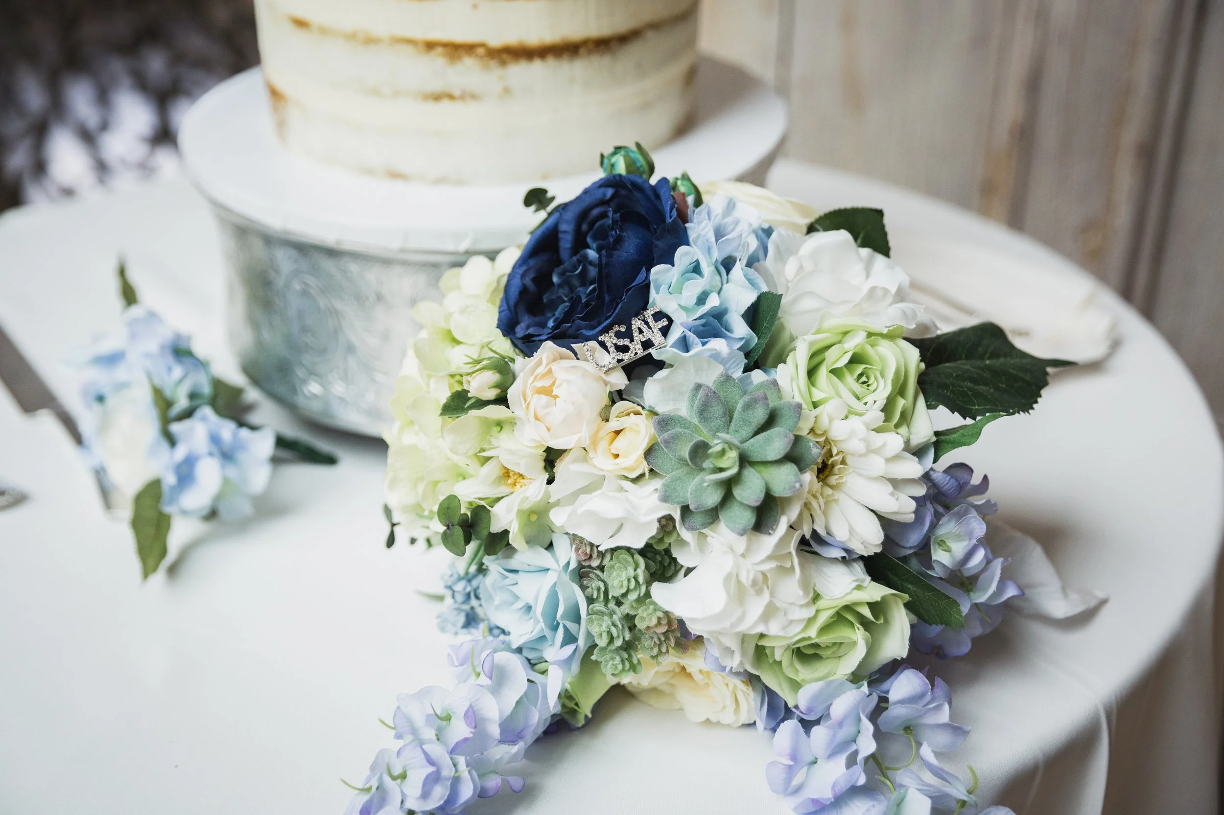 Cake and floral arrangement on a table for celebration