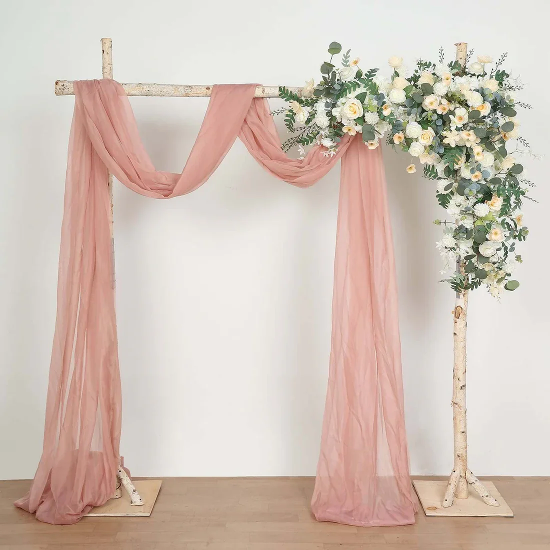 floral-decorated-birchwood-arch.webp