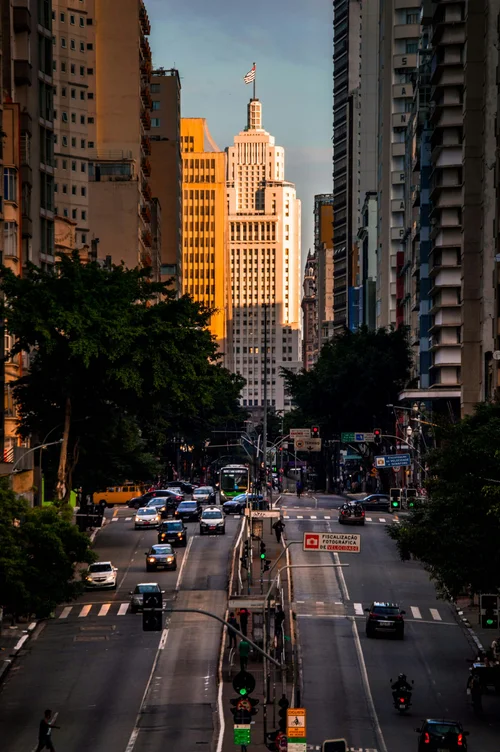 City street at sunset with skyscraper