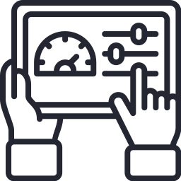 Hand adjusting controls on a digital control panel with a gauge and sliders