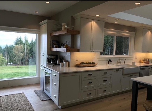 Under-cabinet task lighting and recessed ambient lighting in a finished kitchen remodel