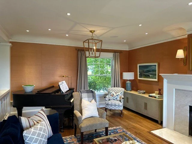 Statement lantern pendant lighting over a piano nook in a living room remodel