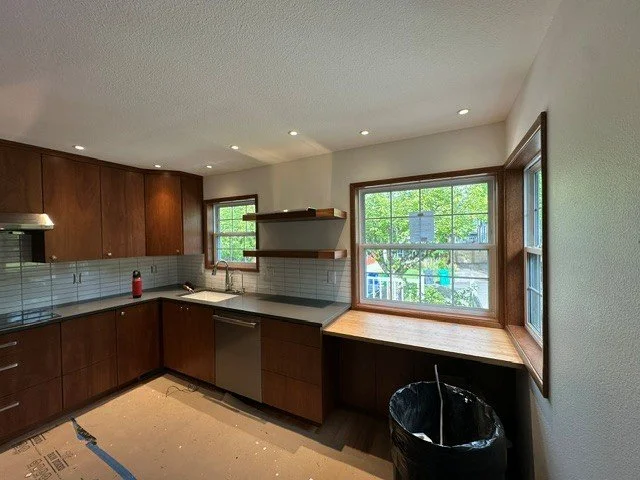 Recessed can lighting spaced for even ambient light in an in-progress kitchen remodel