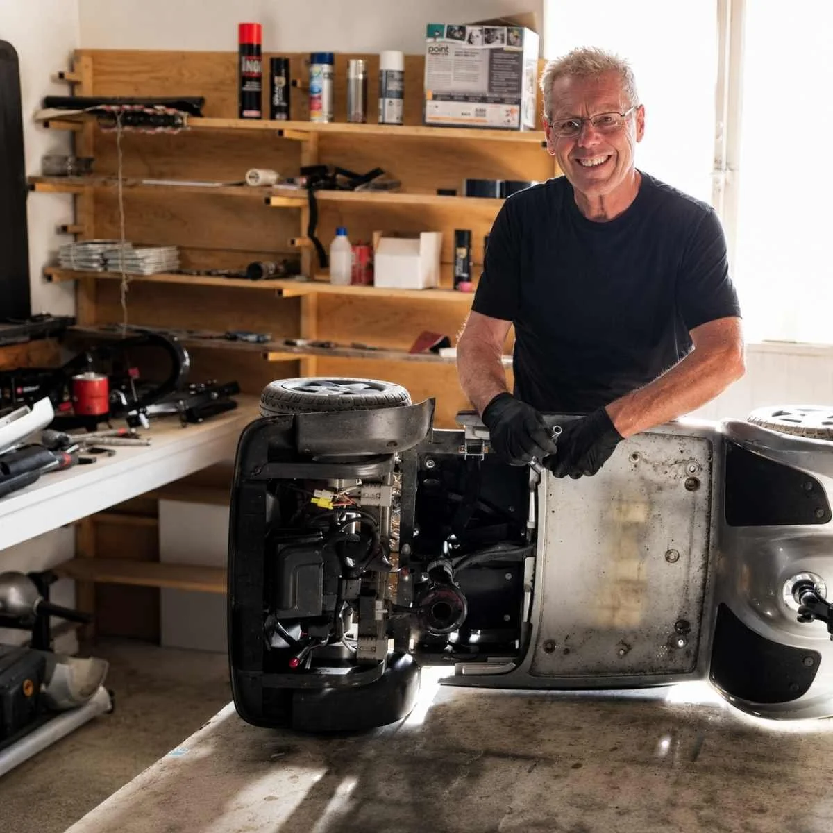 Si from Thrifty Mobility repairing a Mobility Scooter in his workshop in Norfolk, providing honest local Mobility Scooter and powerchair repair support at customers homes