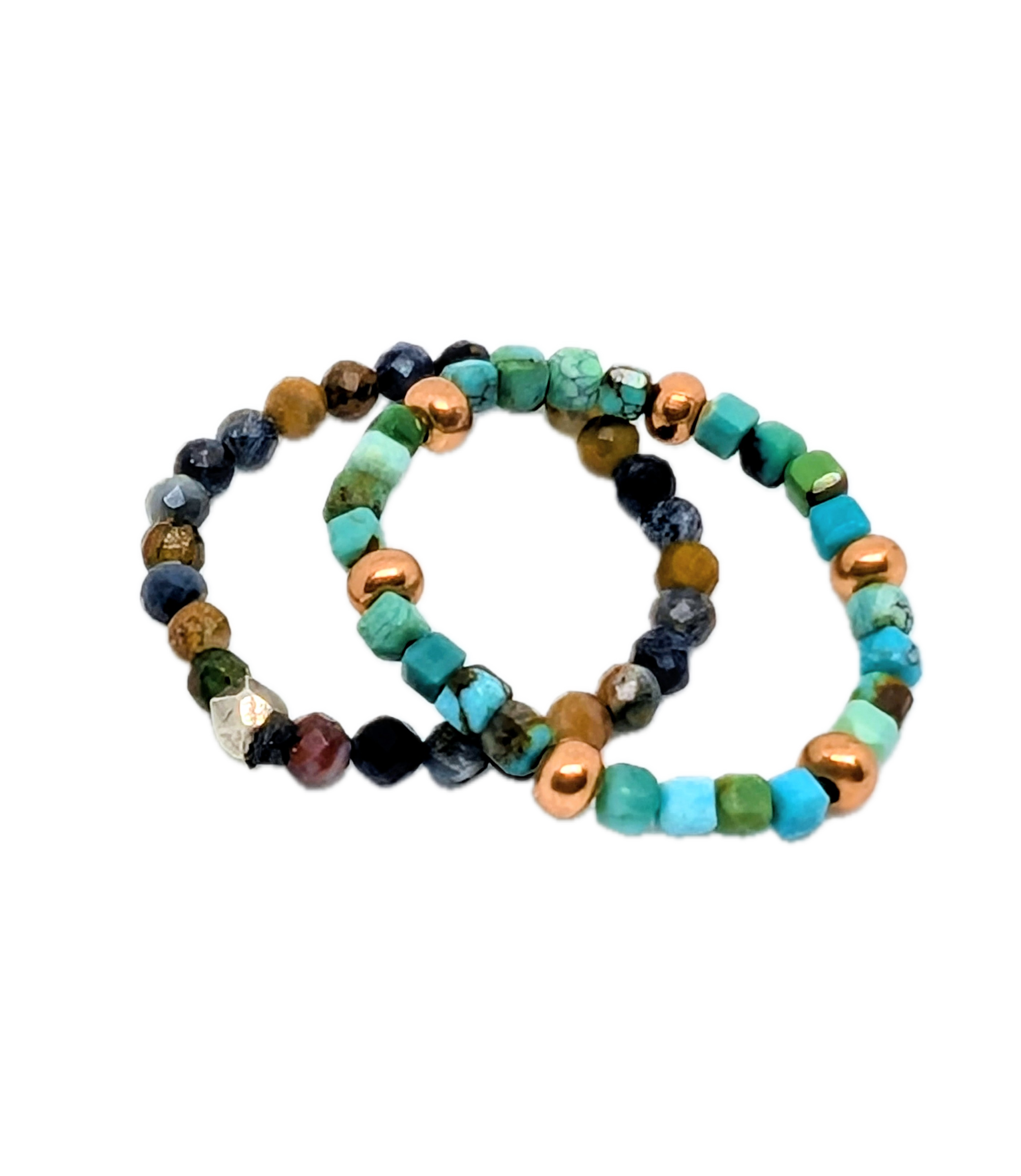 Close-up of beaded bracelets made from assorted turquoise, gold, and black beads, arranged in a circular pattern.