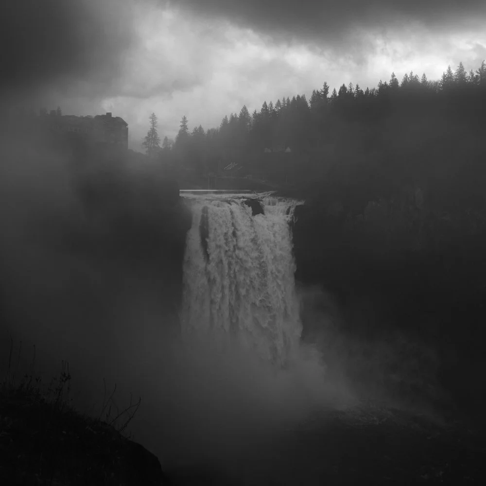 Water cascades over Snoqualmie Falls amidst heavy mist and dense seasonal cloud cover, Thursday, Nov. 13, 2014, in Snoqualmie, Washington.