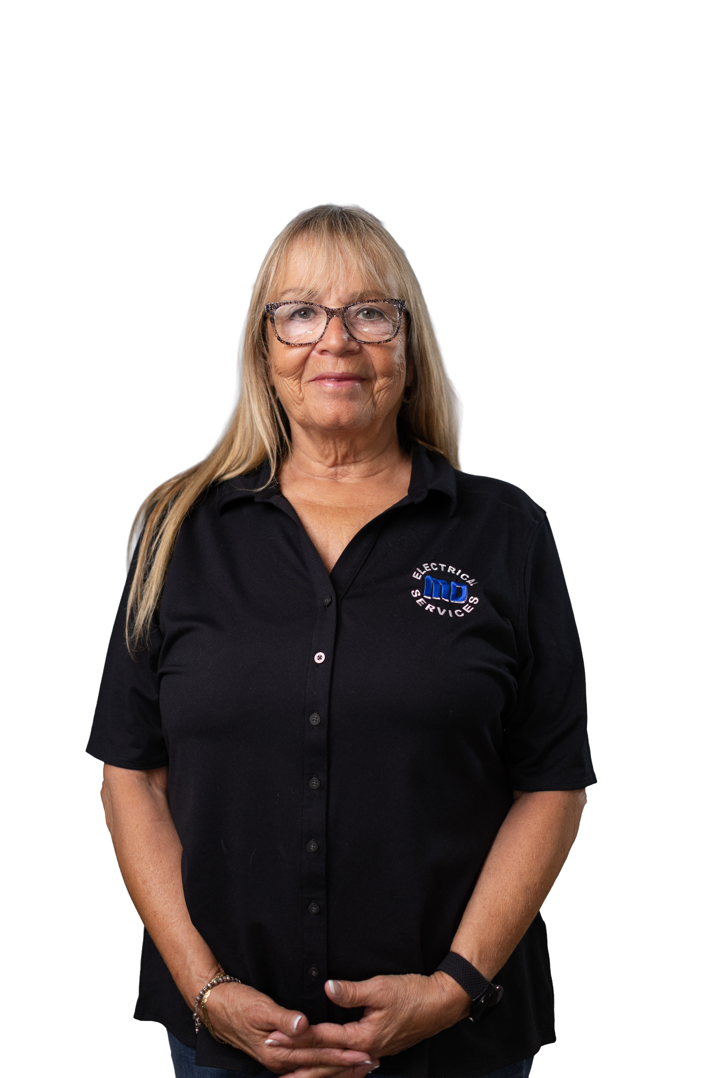 A woman with long blonde hair, glasses, and a black button-up shirt with a logo, standing with her hands clasped in front of her, smiling slightly against a digital background with colored lines and gradient blocks.