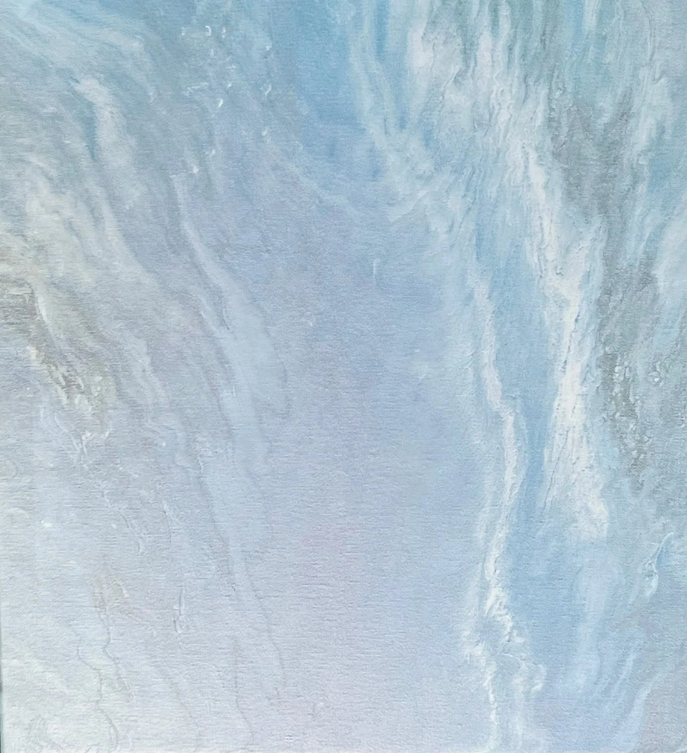 A textured surface resembling a painted or plastered wall with shades of blue and white.