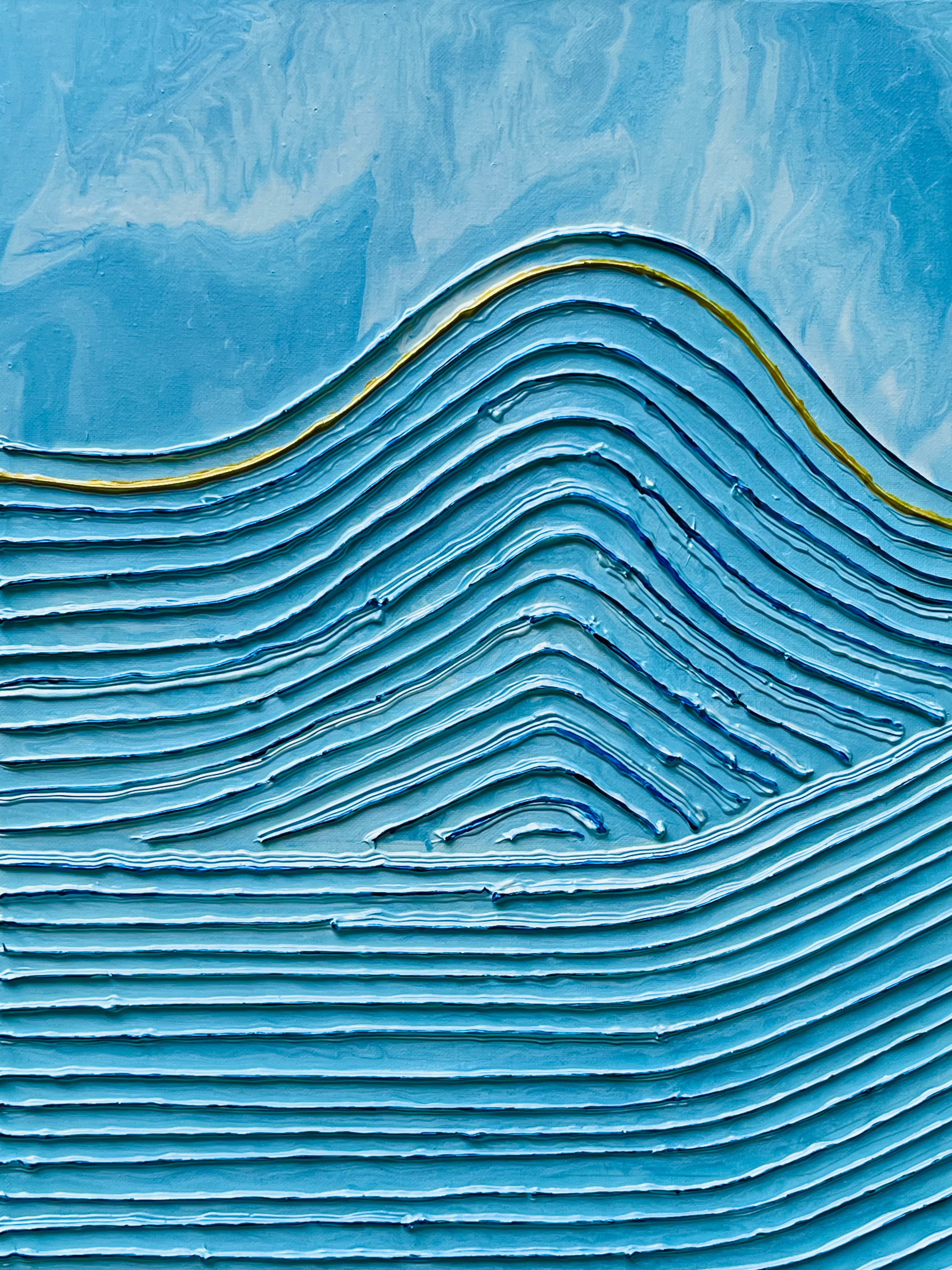 Close-up of a textured abstract painting with layered wavy lines in shades of blue and gold.