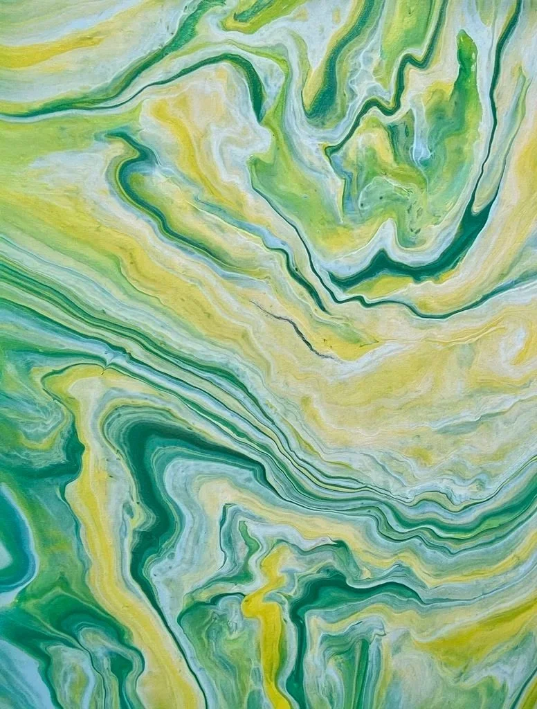 Abstract marbled artwork with swirling patterns in various shades of green, yellow, and hints of blue.
