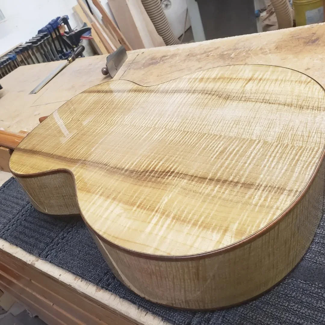 Concert Model
Bearclaw Englemann Spruce 
Curly Oregon Myrtle  