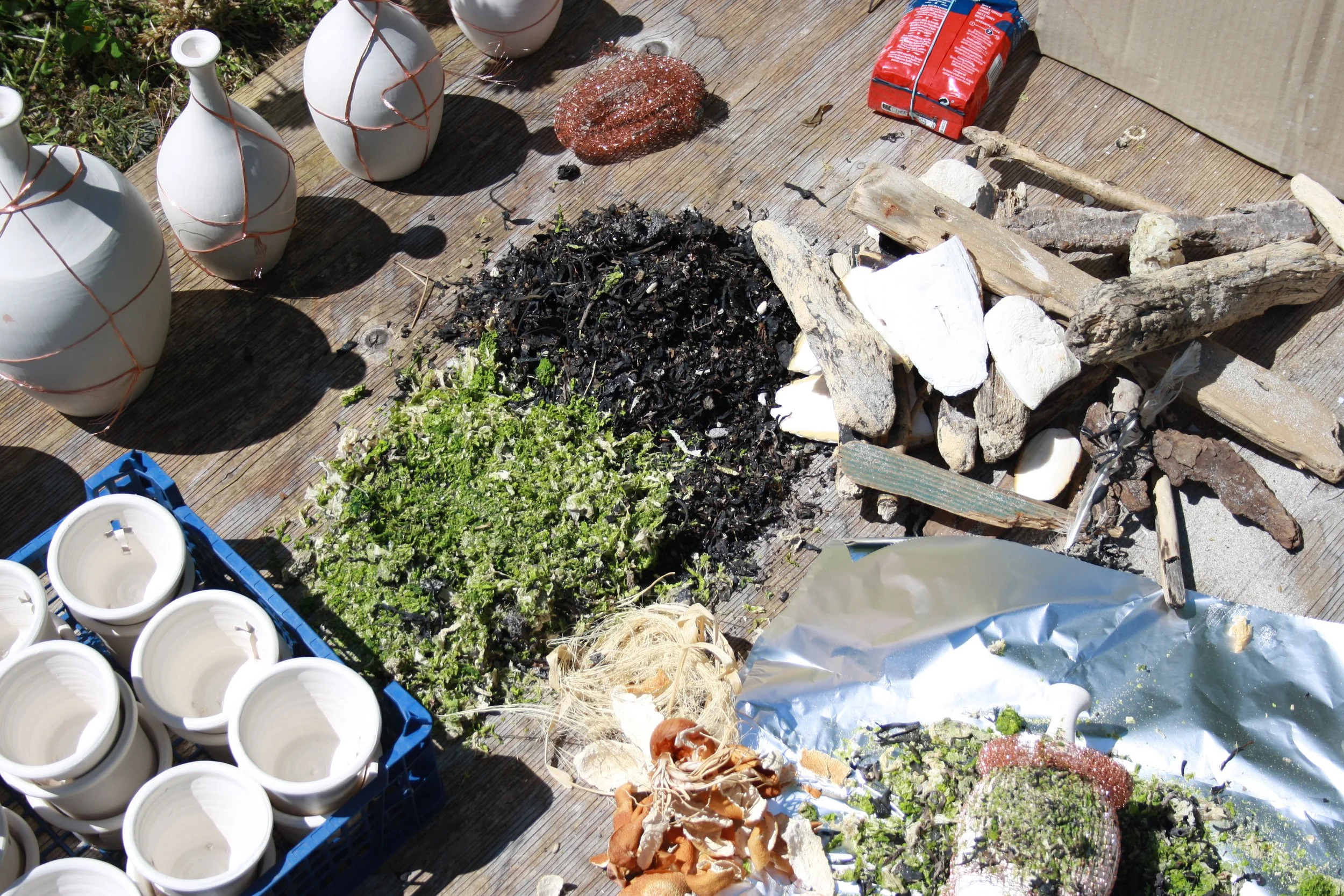 Materials are gathered and dried in preparation for the firing. Seaweeds, copper wire, cow dung, dried fruit skins and nuts.