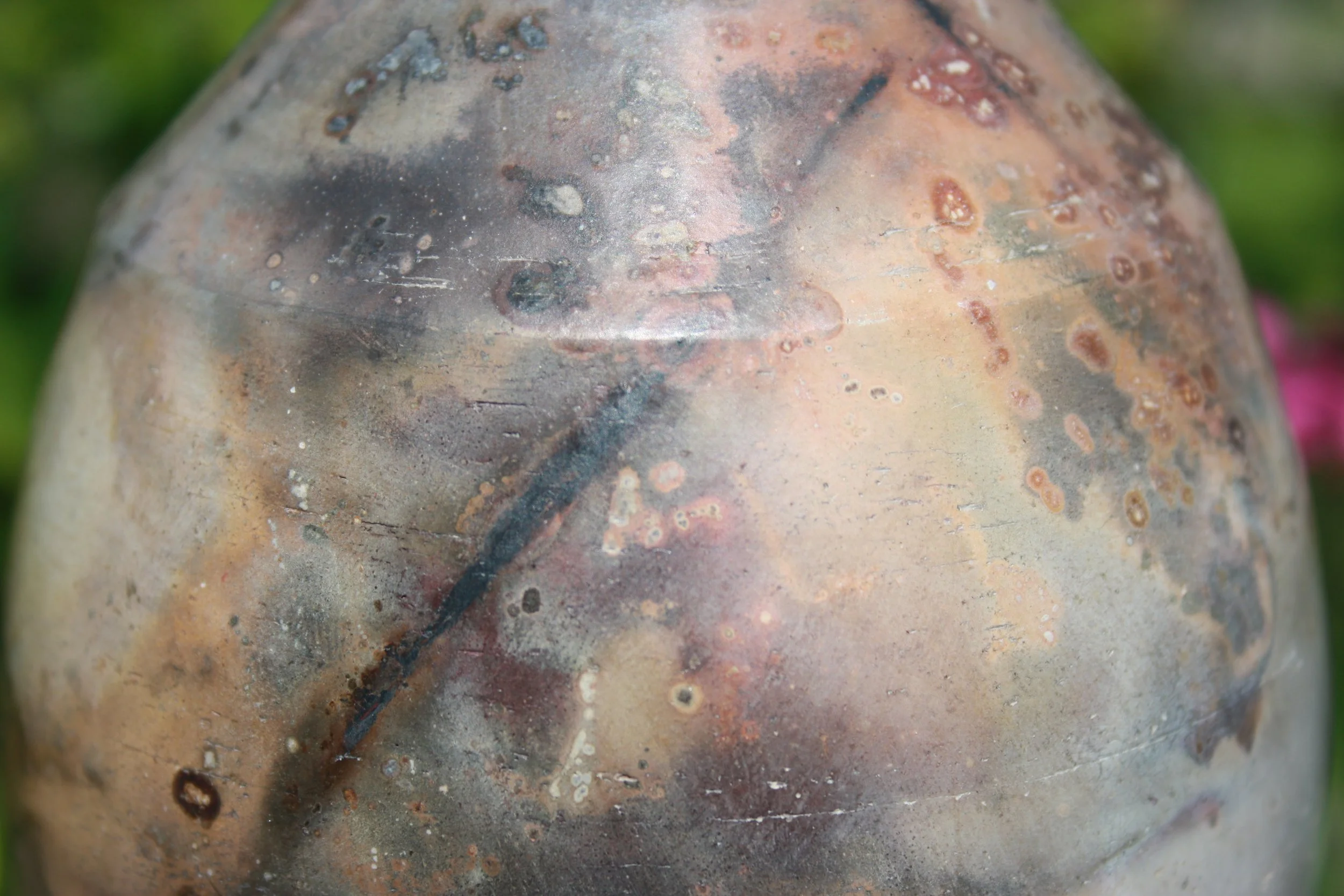 After the kiln has cooled the pots are unearthed from there ashes to reveal their unique and beautiful surfaces, rich in colour and patterns.