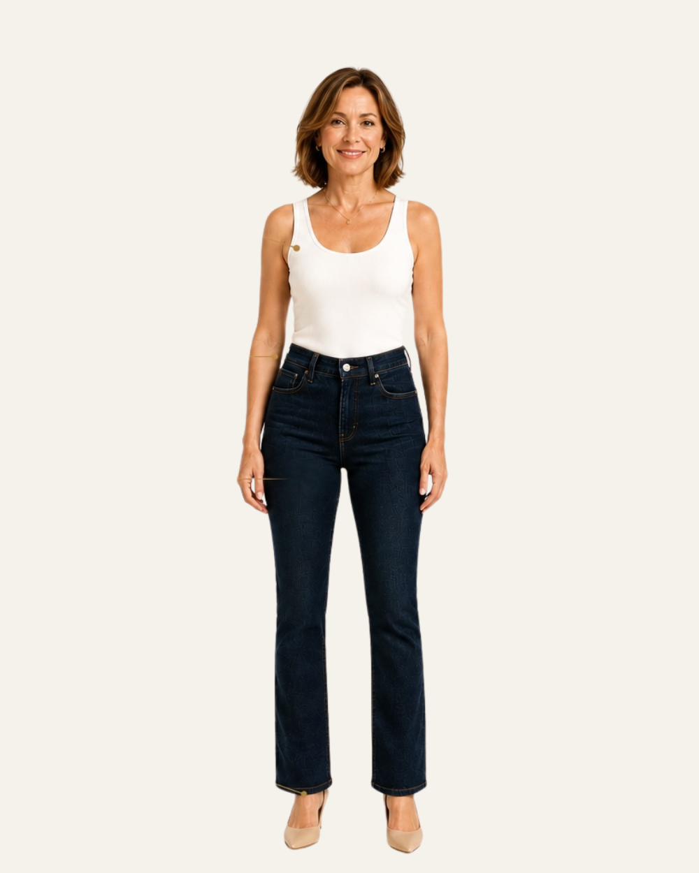 Petite woman wearing dark blue straight-leg jeans and a white sleeveless top.
