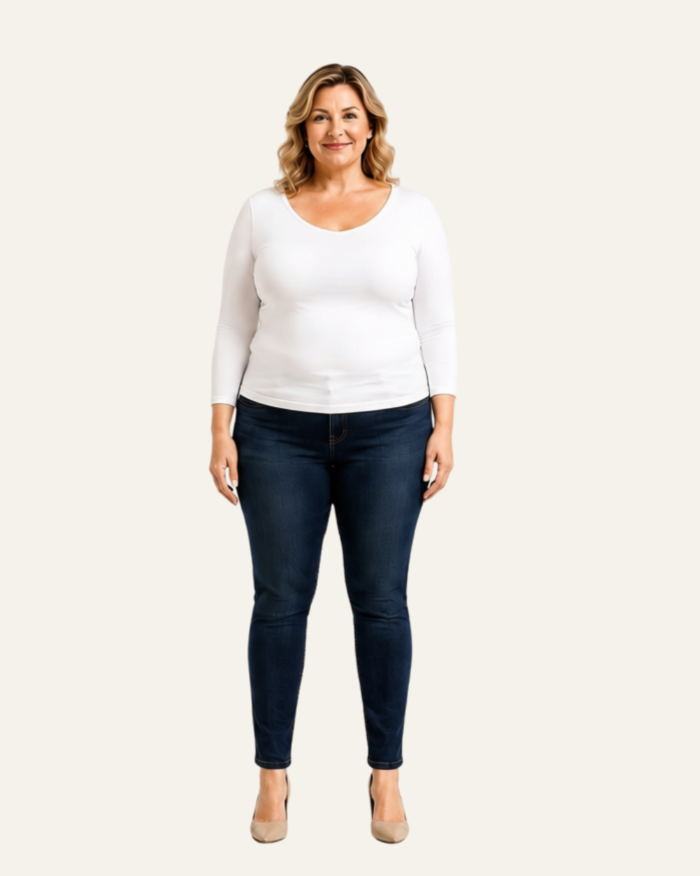 Woman with an apple body shape wearing dark blue straight-leg jeans and a white top.