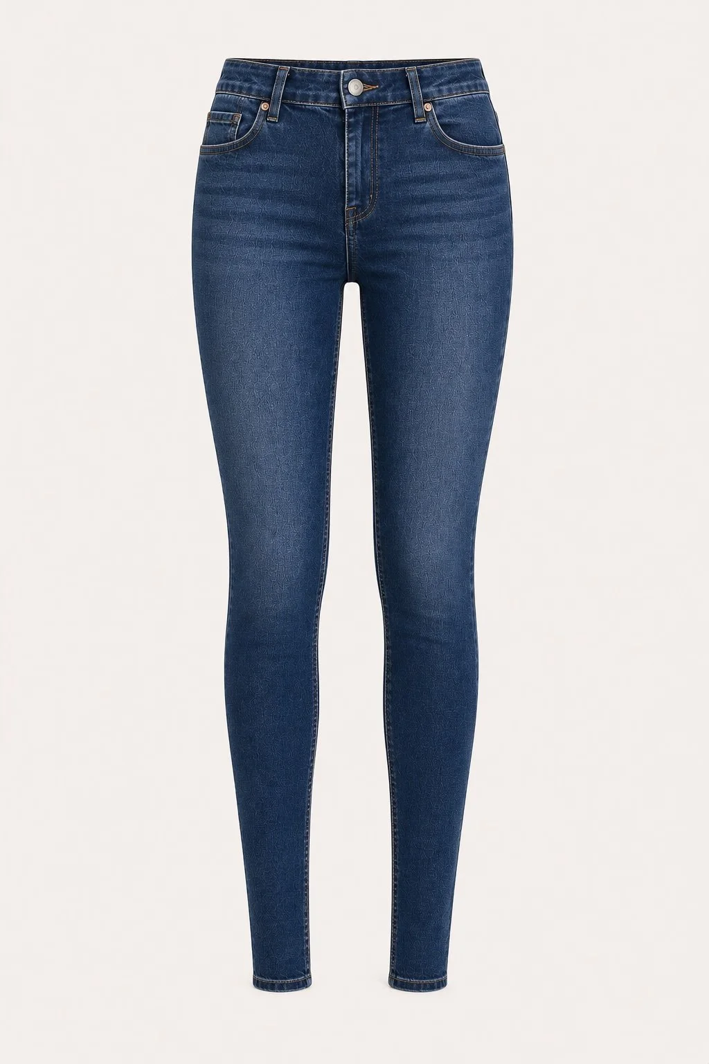 Pair of blue skinny jeans with a button and zip closure, front pockets, and gold stitching, against a white background.