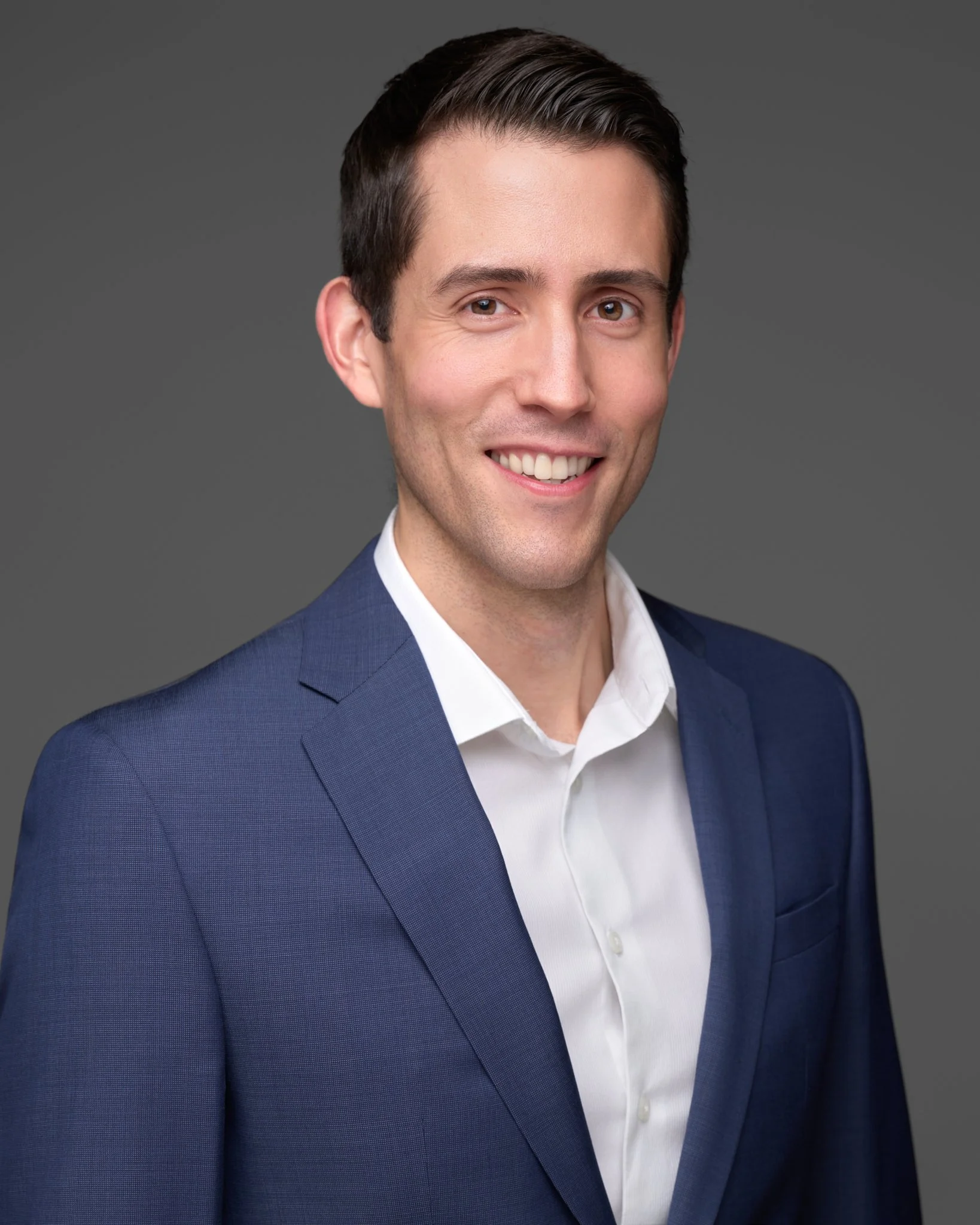 Headshot of Kevin Pietracci, founder of Jorheim CFO, wearing a navy suit jacket and white dress shirt.