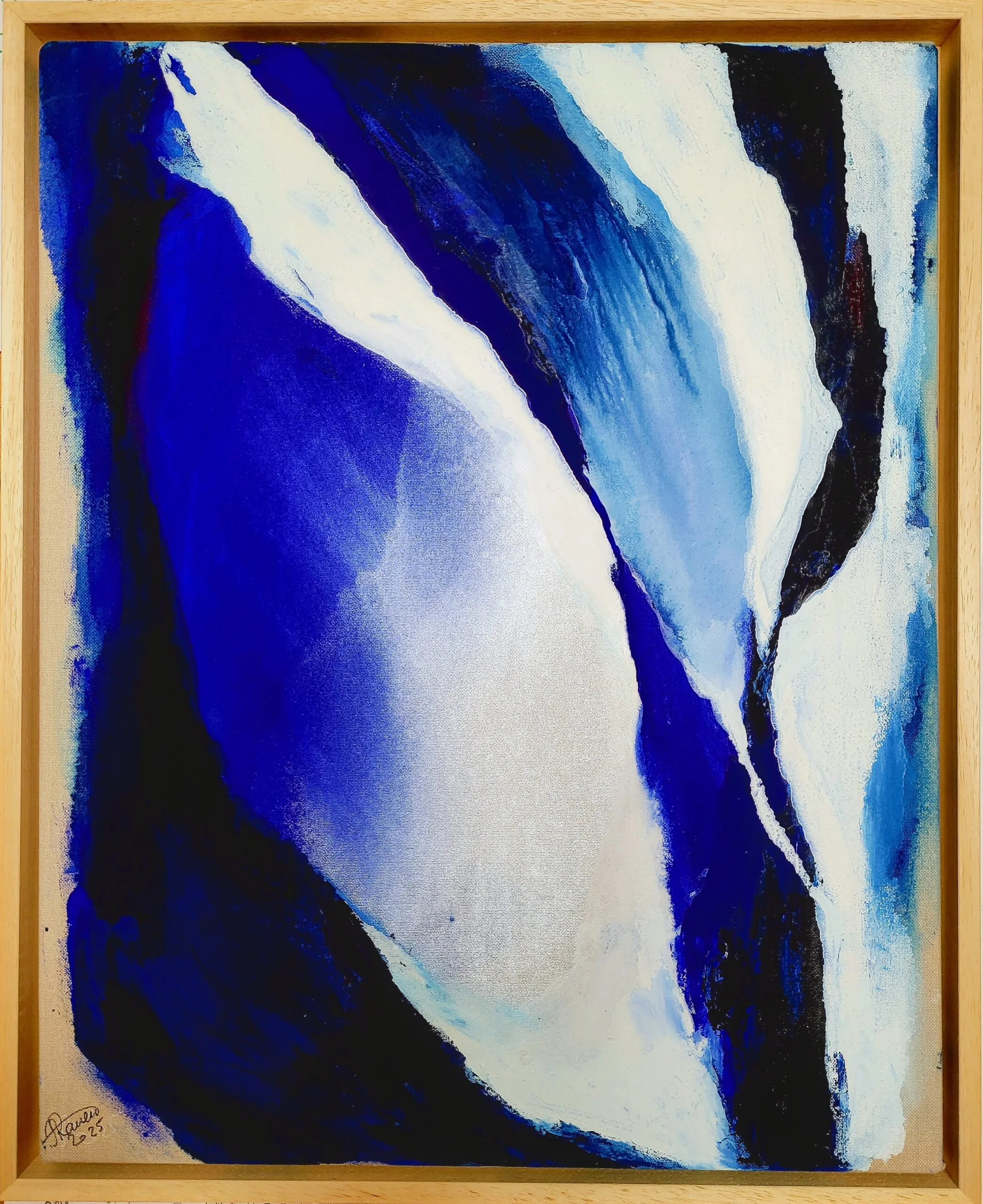 An abstract painting with bold blue, black, white, and hints of red colors, framed in wood, signed in the bottom left corner.