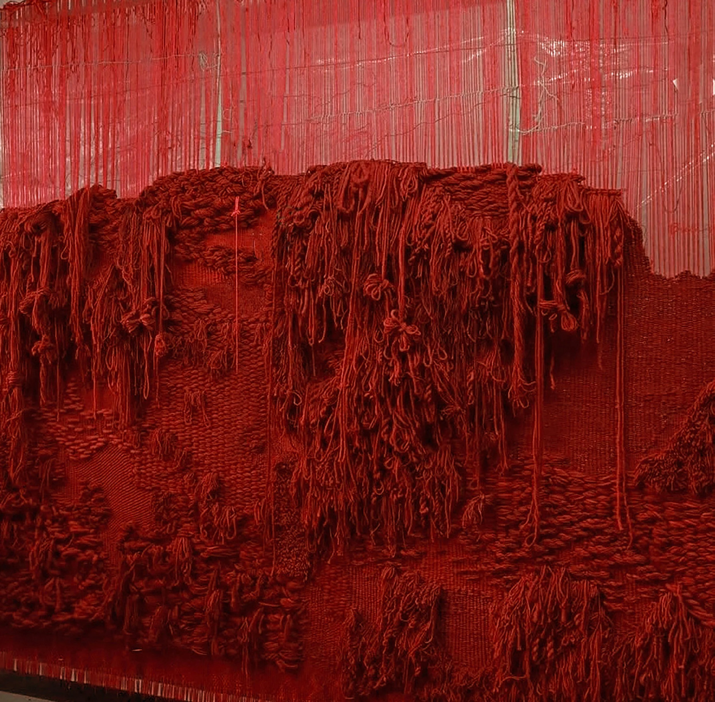 Handwoven red wool textile installation by Jo Baker Waters for Architecture of Tailoring, exploring weaving, British wool and contemporary textile art.