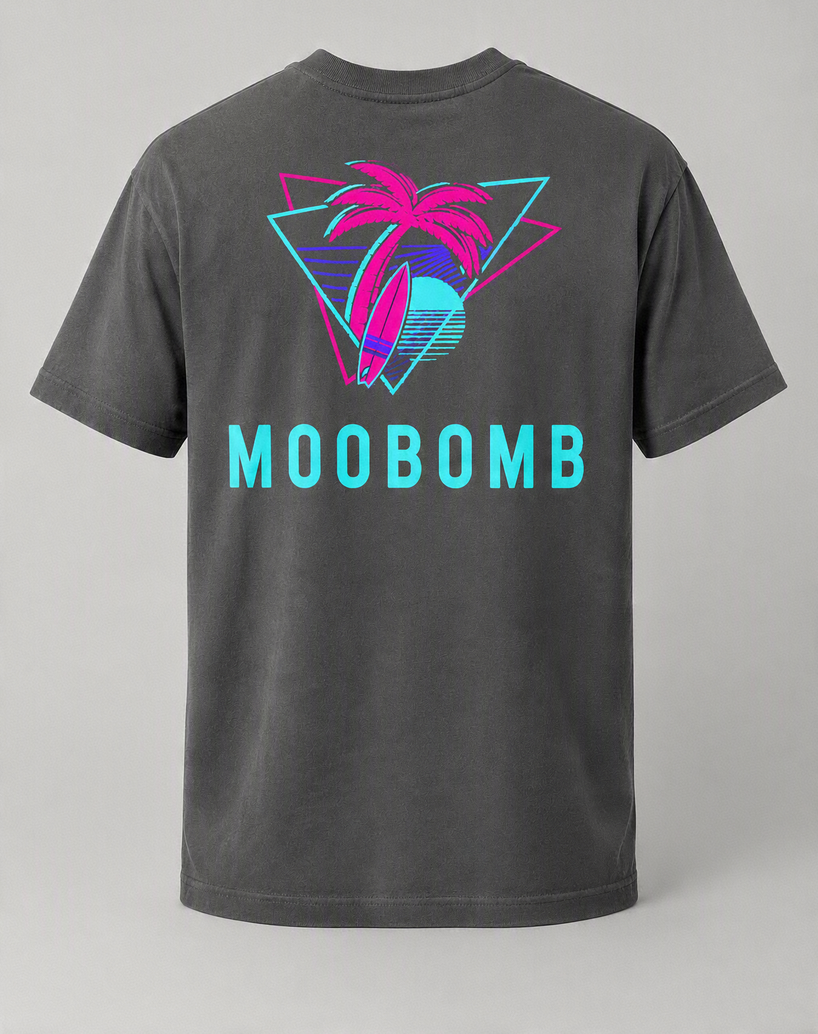 Gray T-shirt featuring a neon-style design of a pink palm tree with a surfboard, a sun, and water, with the word 'MOOBOMB' in large blue letters below.