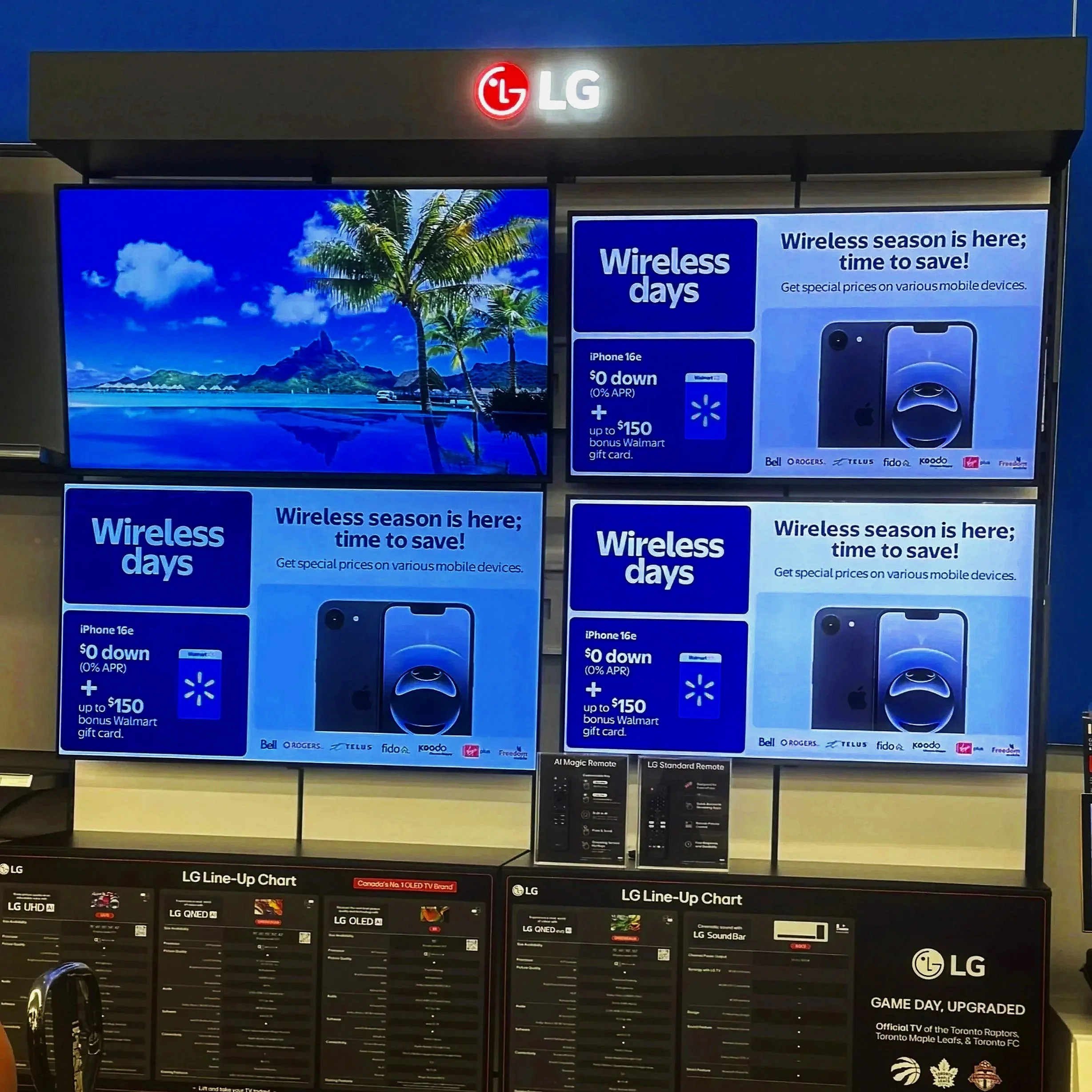 Store display with multiple digital screens showcasing promotional content for wireless plans, mobile devices, and TV upgrades, with the LG logo at the top and various product images and text.