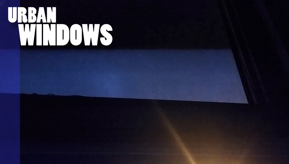 Lightning and Street Light Glow Through the Window