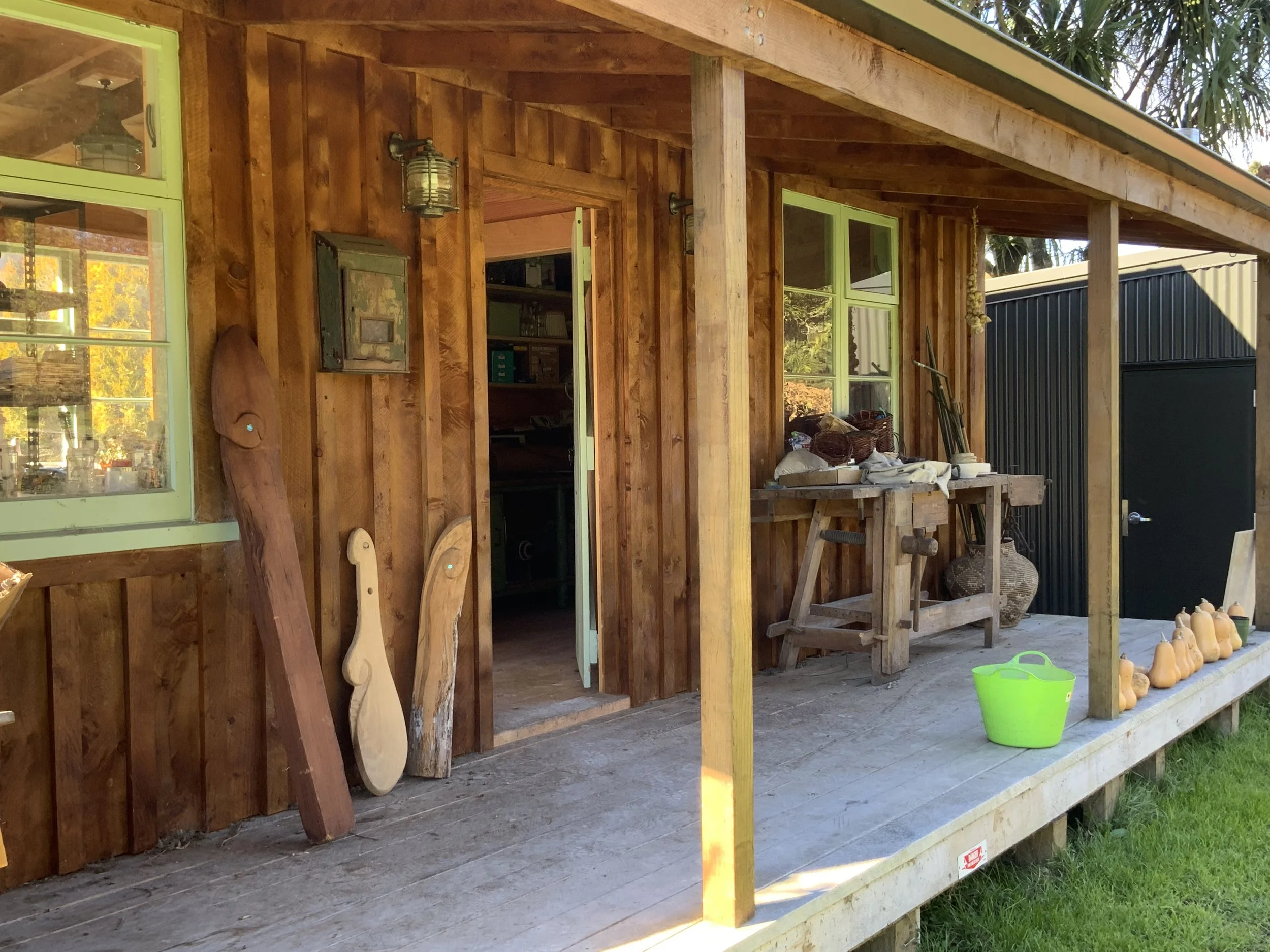 Art studio wooden outbuilding with a porch