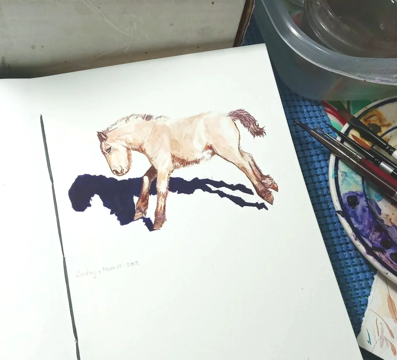 Watercolor study of a running draft mix foal with a white background.