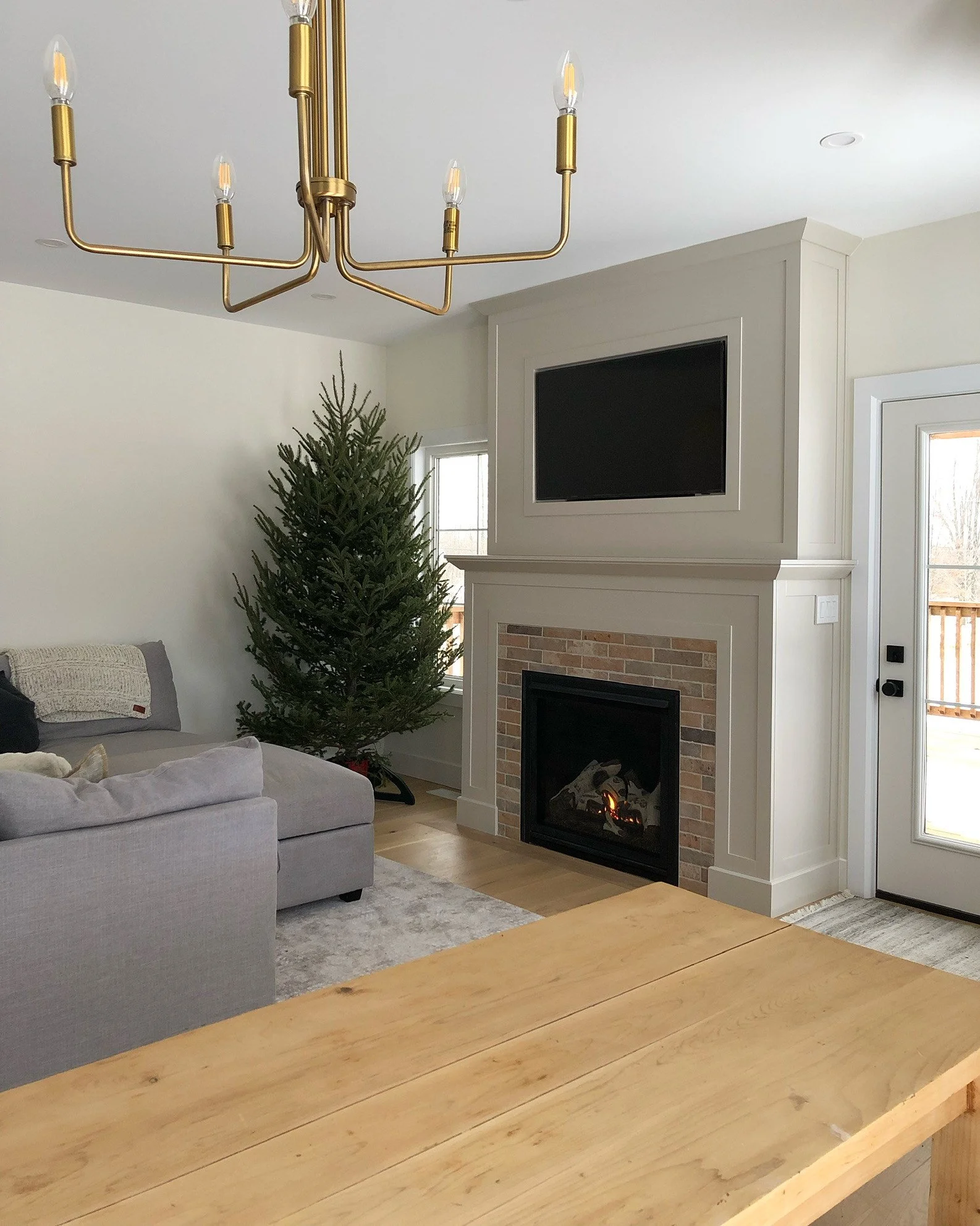 Living room with custom fireplace millwork. Mantel and Trim.