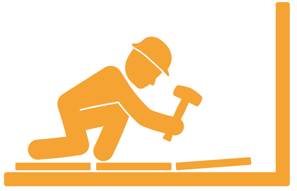 Silhouette of construction worker kneeling, wearing a safety helmet, and using a hammer to work on a horizontal surface, with a wall in the background.